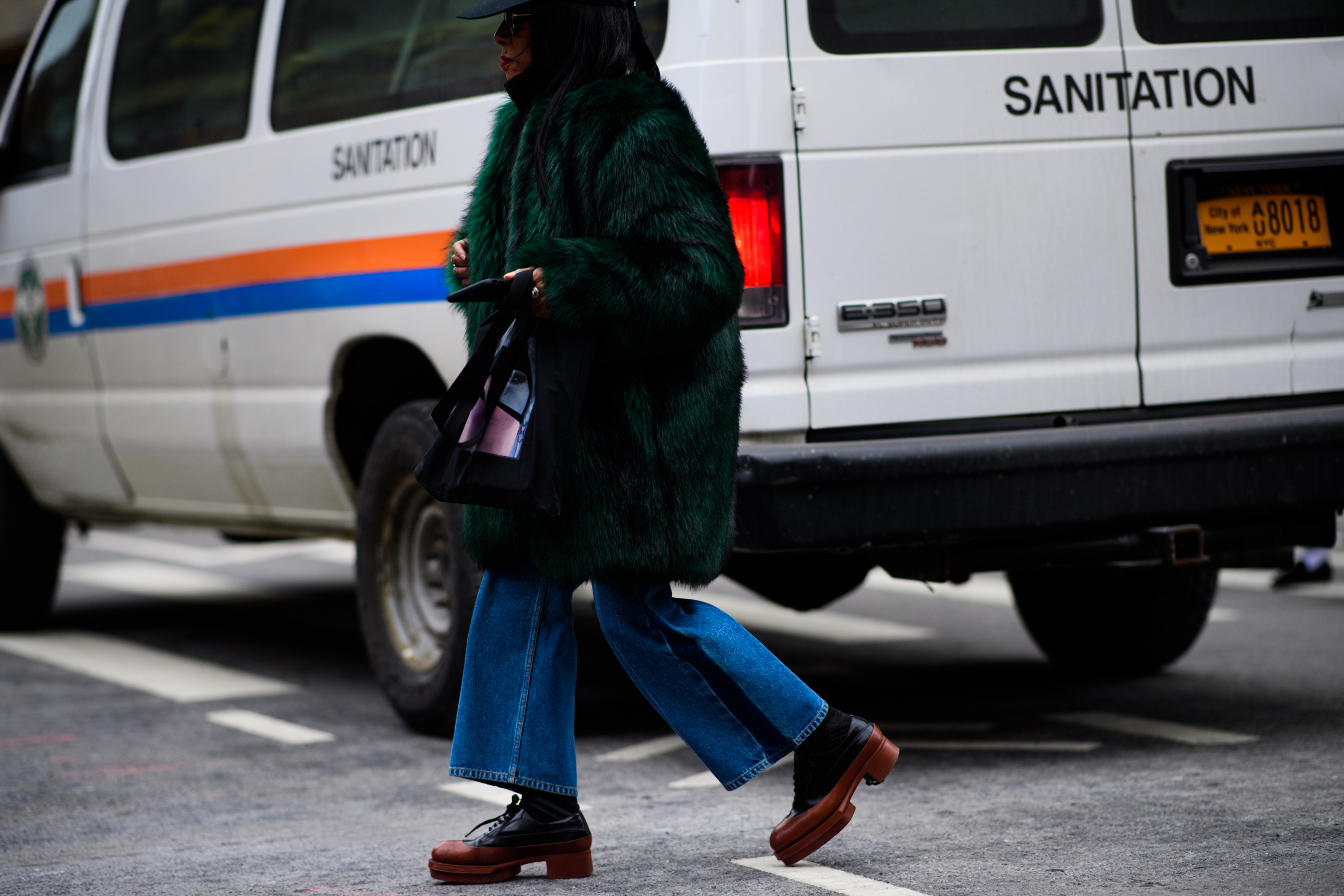 Stylist wearing green fur coat