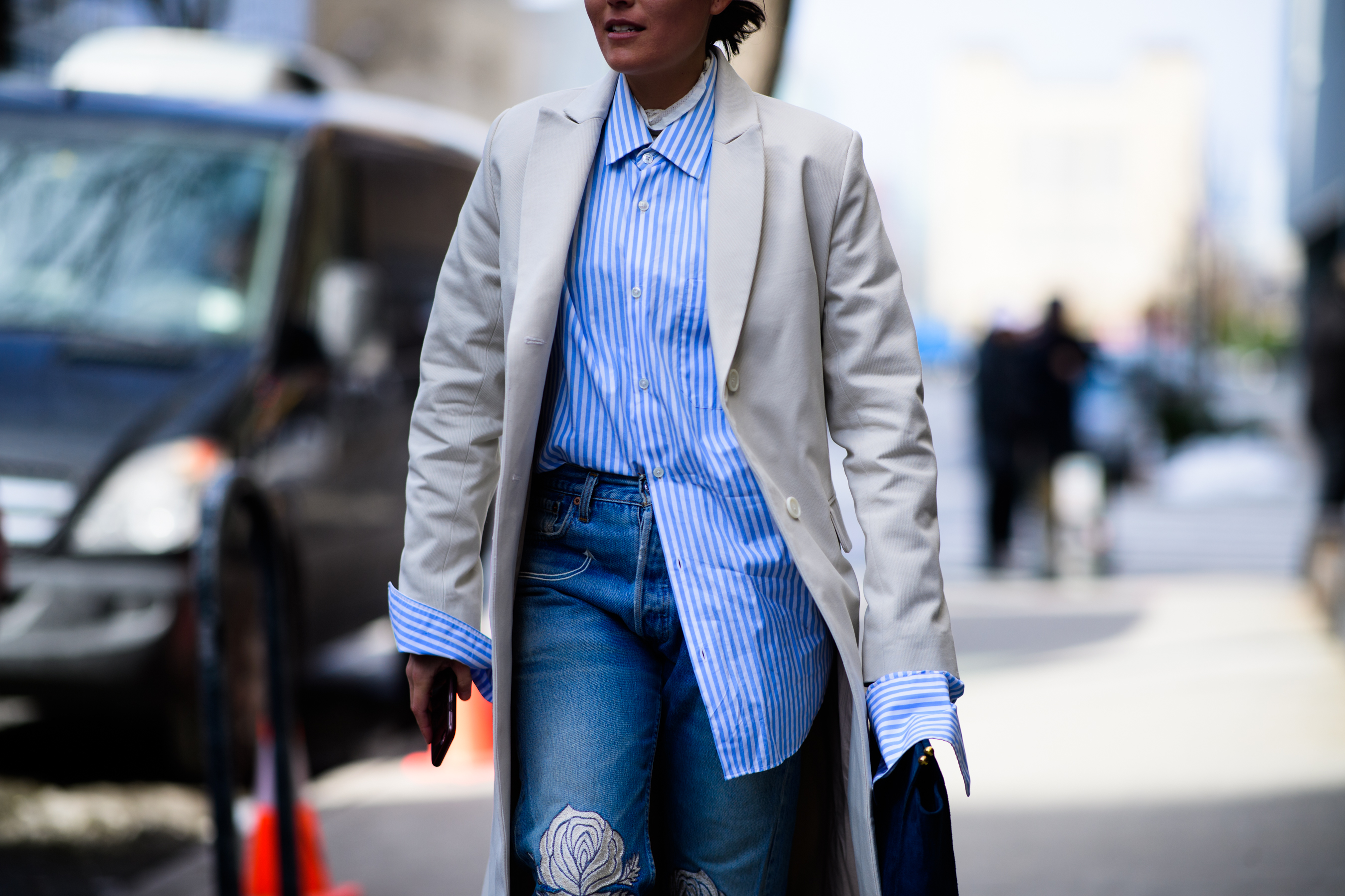 Editor wearing blue striped shirt