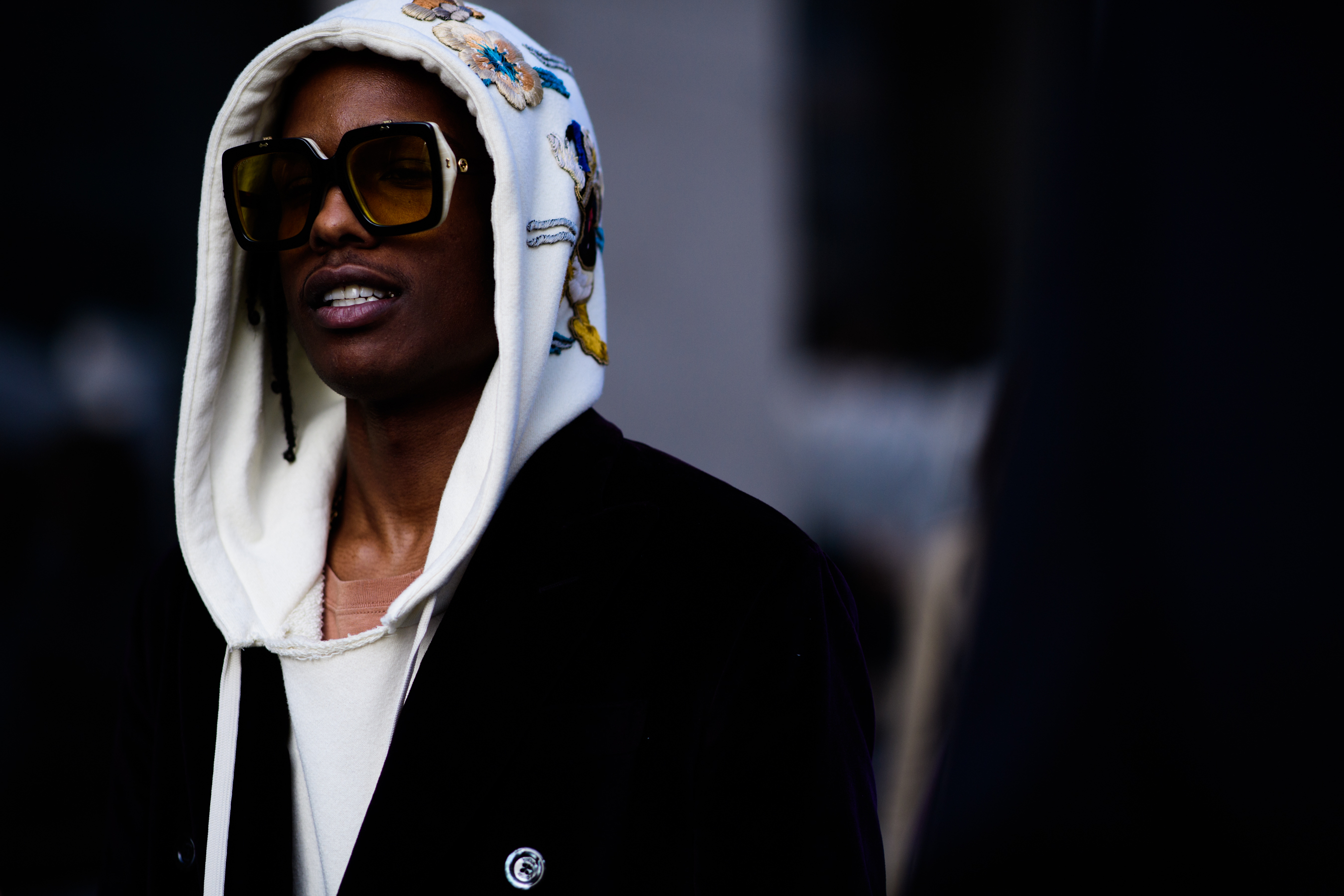 Rapper wearing Gucci hoodie