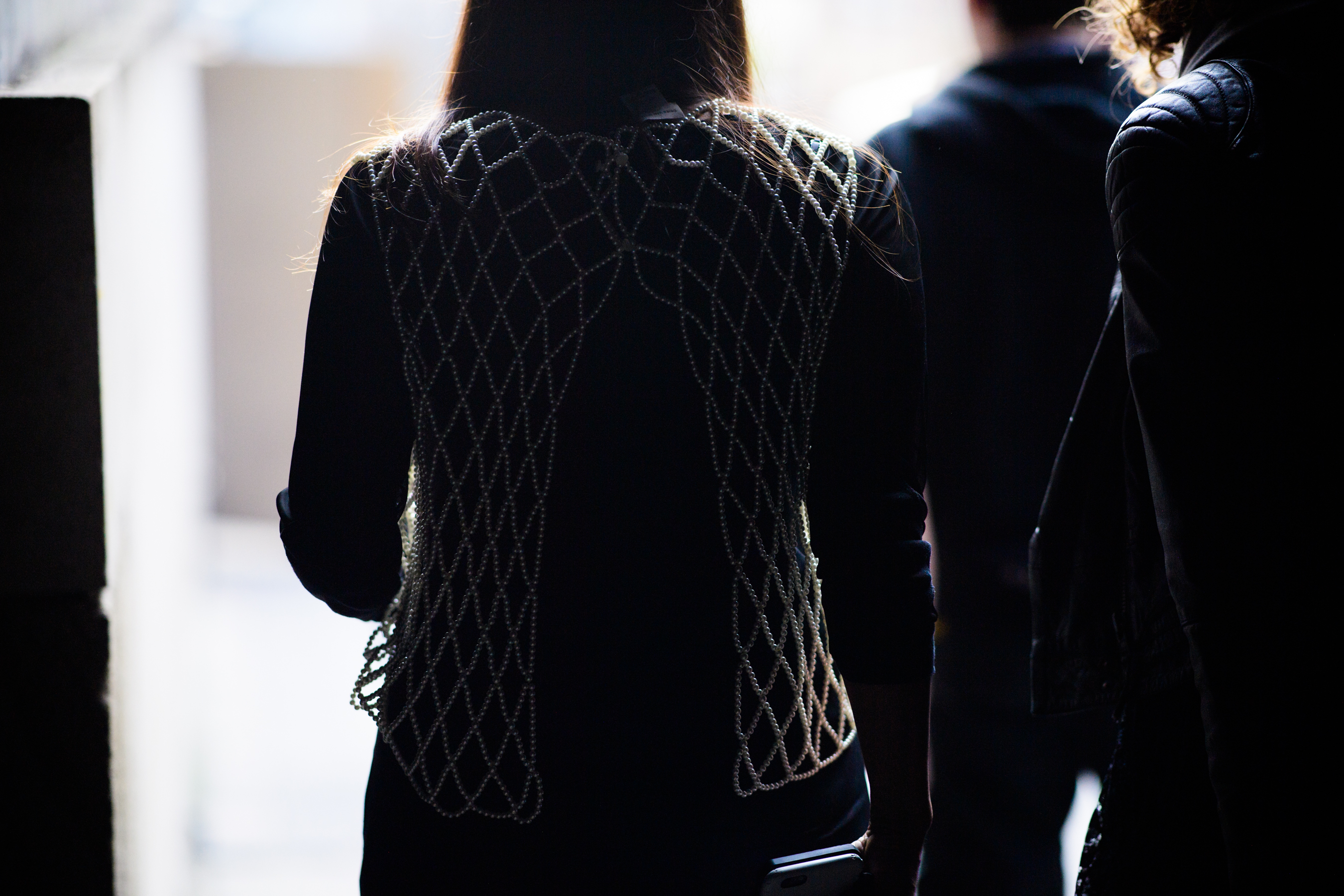Woman wearing pearl vest