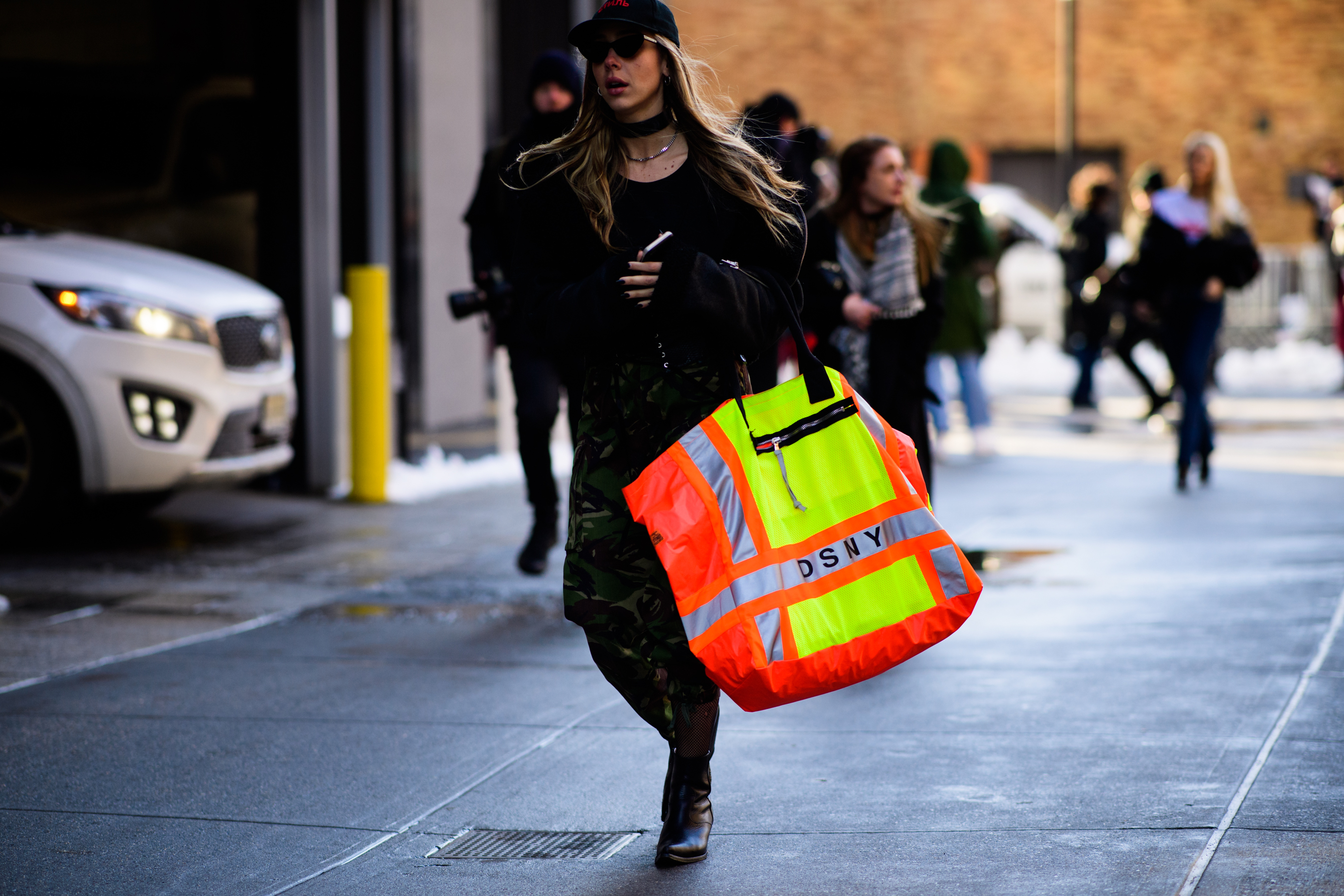 Woman wearing DSNY handbag