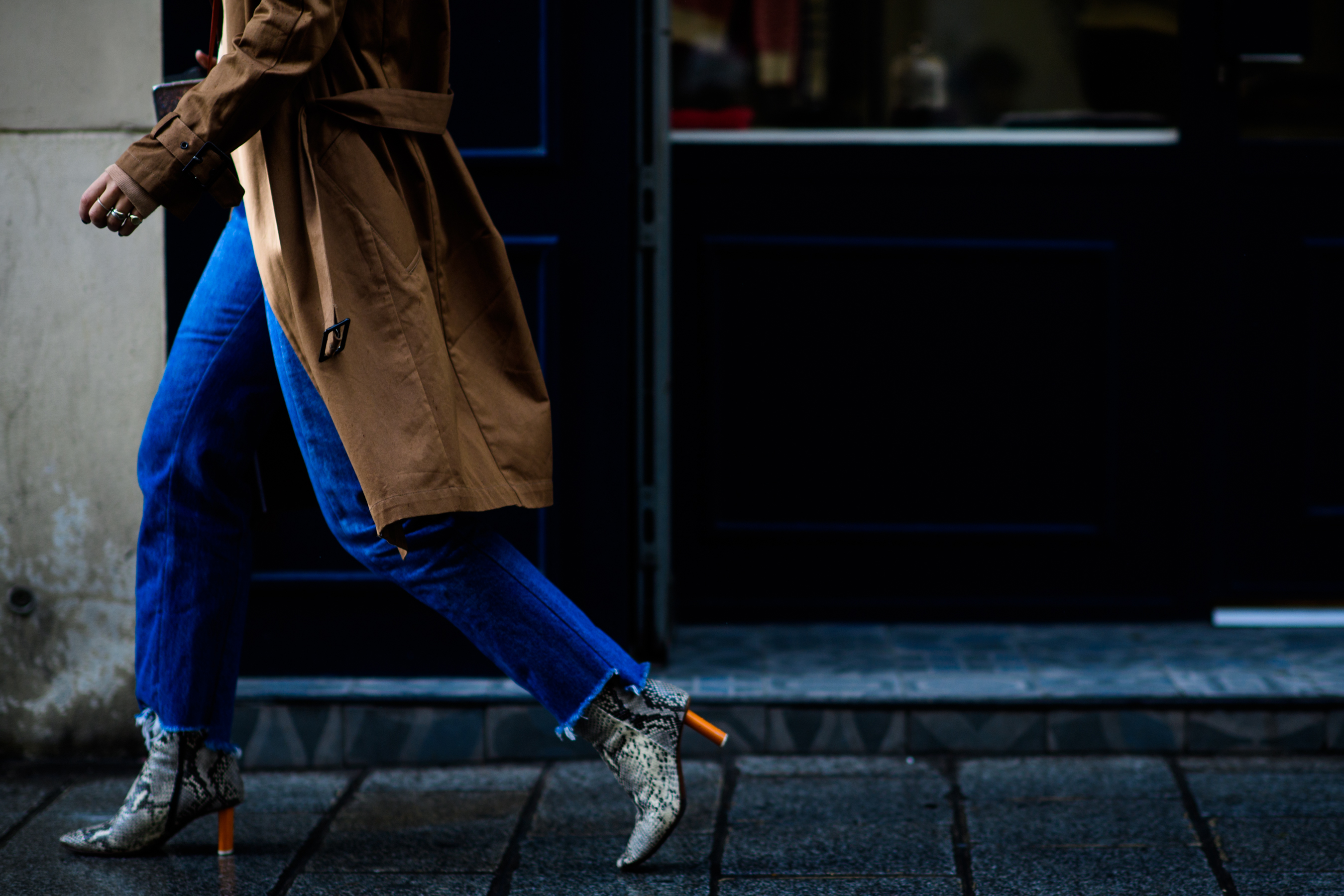 Woman wearing Vetements snakeskin boots