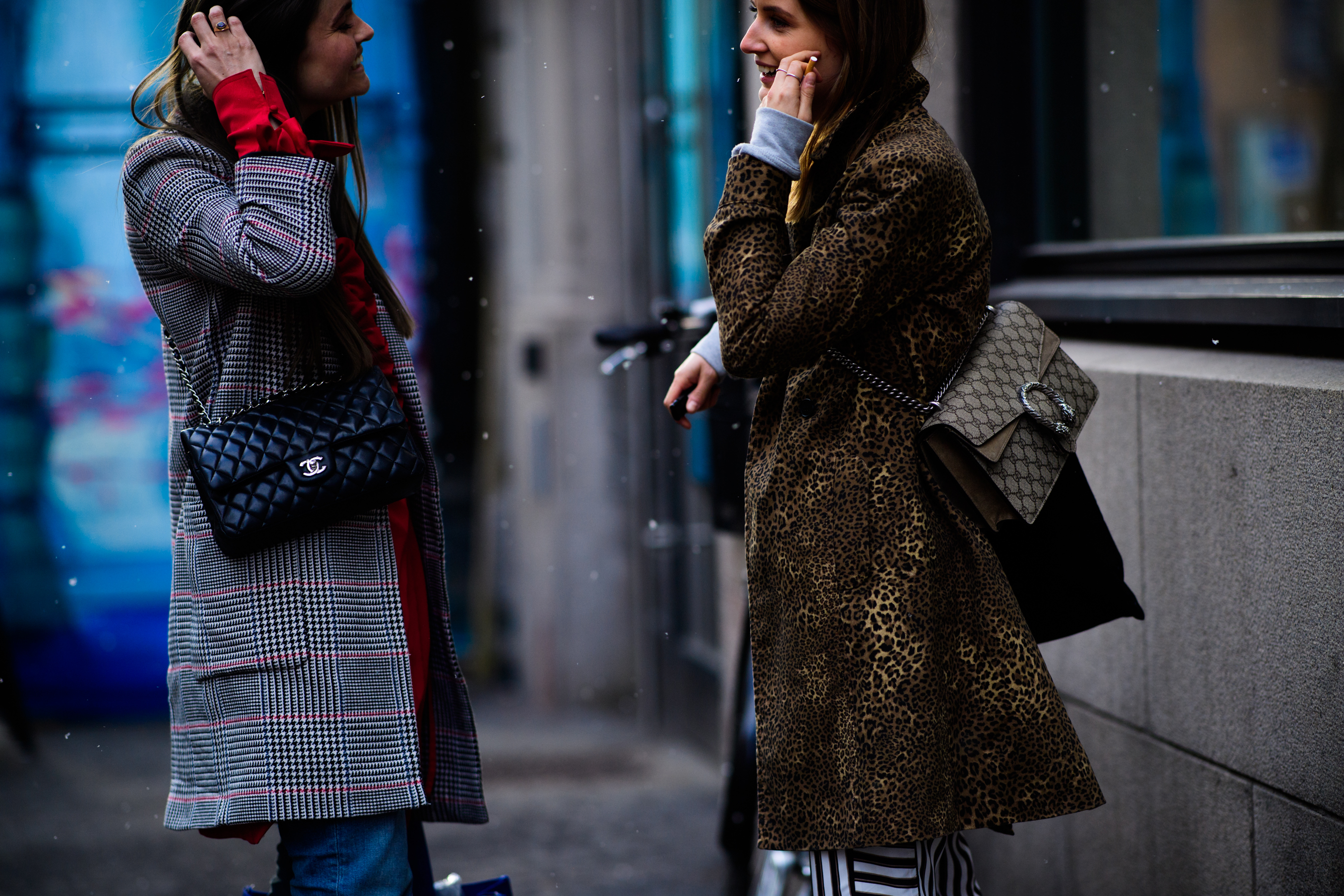 Women wearing Chanel and Gucci handbag