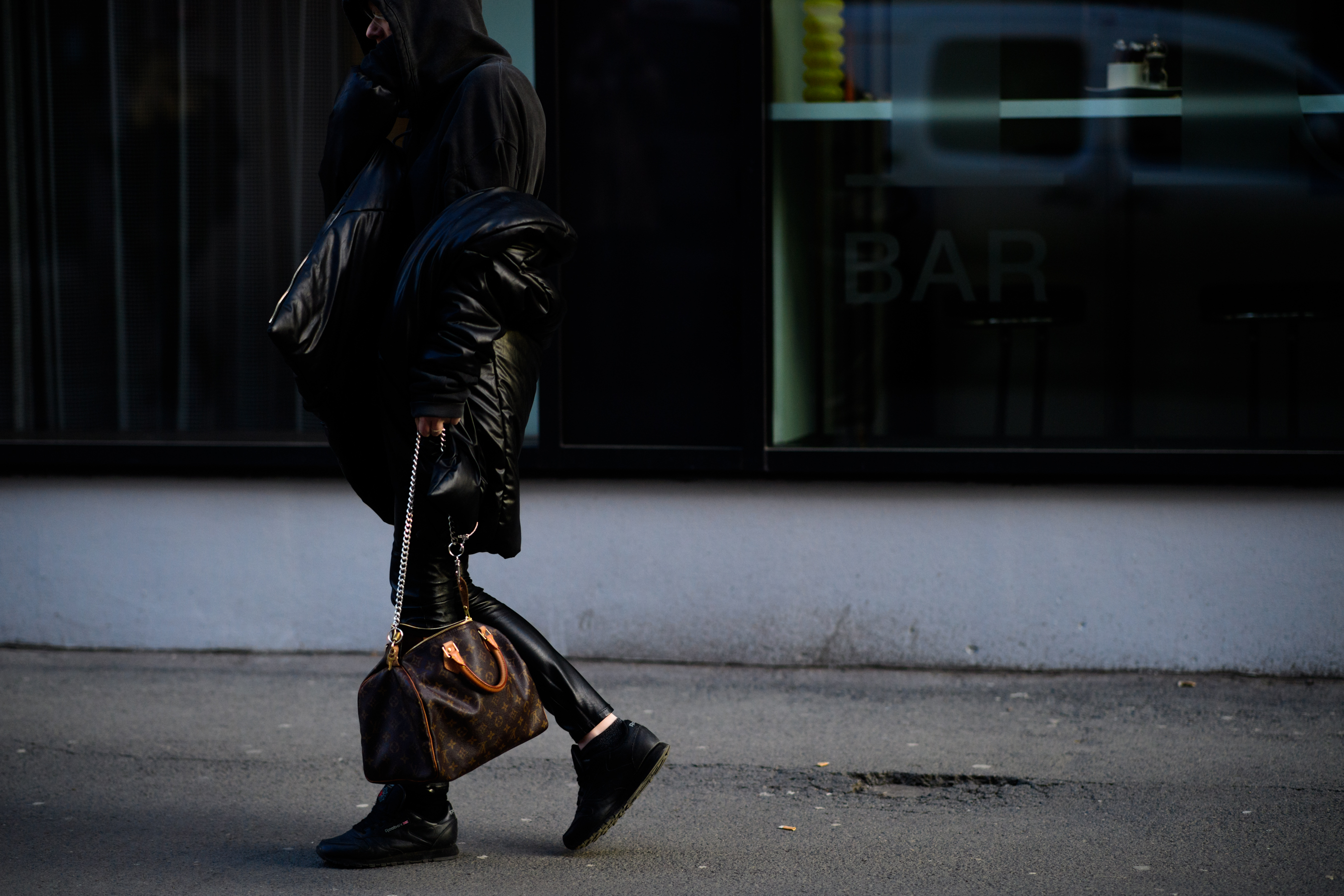 Woman wearing Louis Vuitton handbag