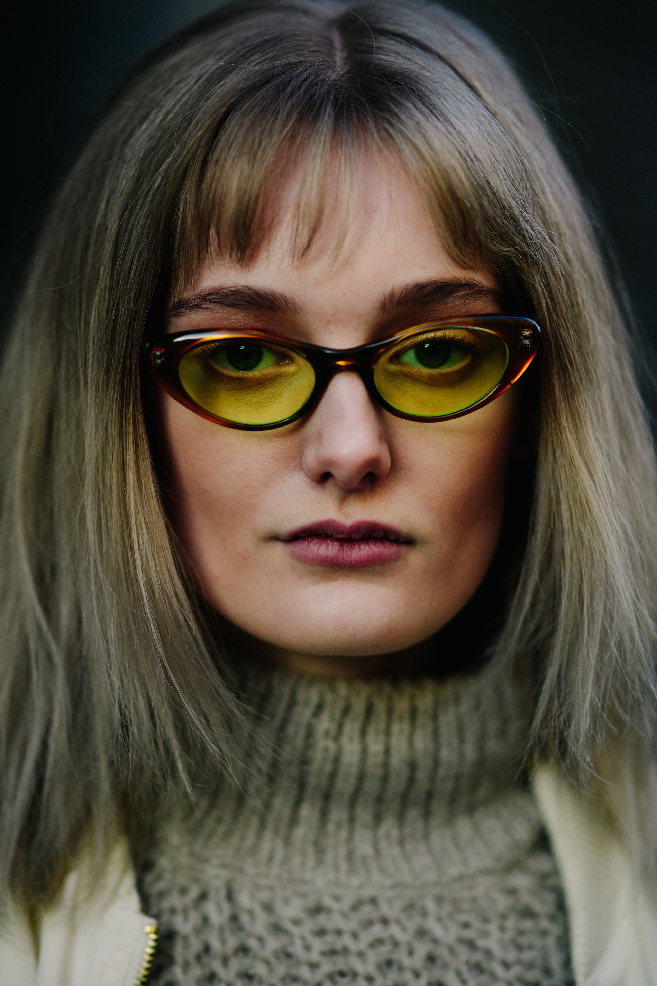 Woman wearing yellow glasses