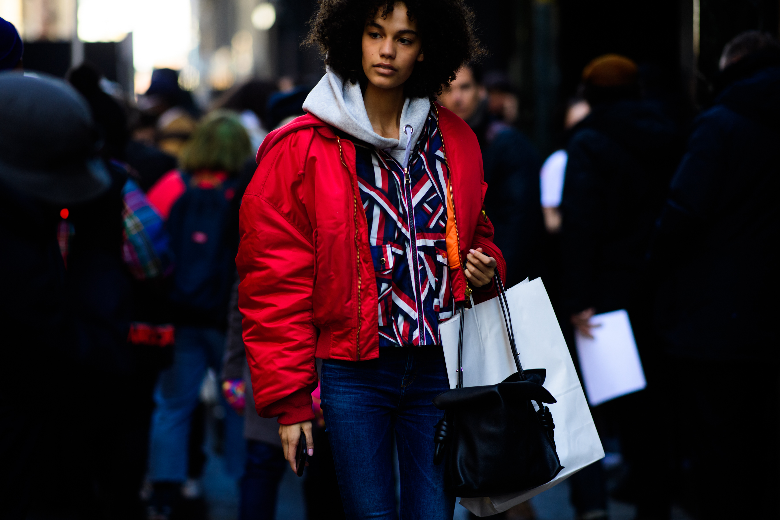 Woman wearing red bomber