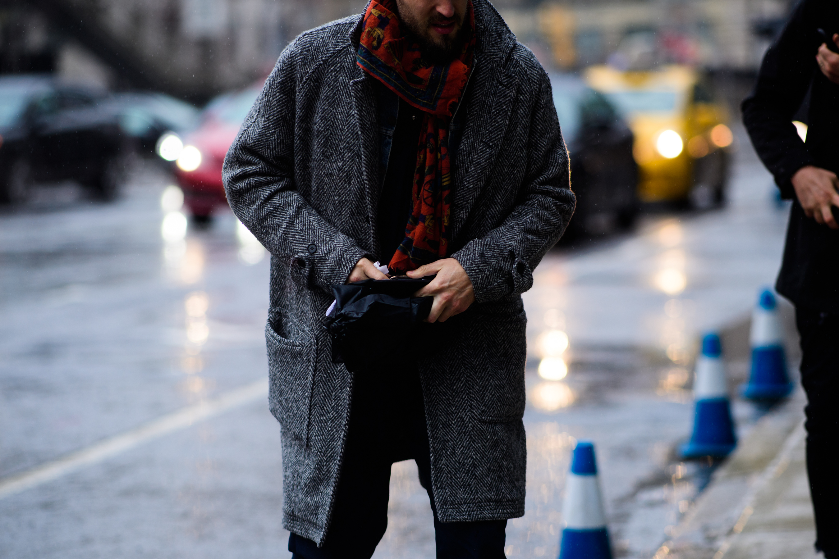 Man wearing grey coat and scarf