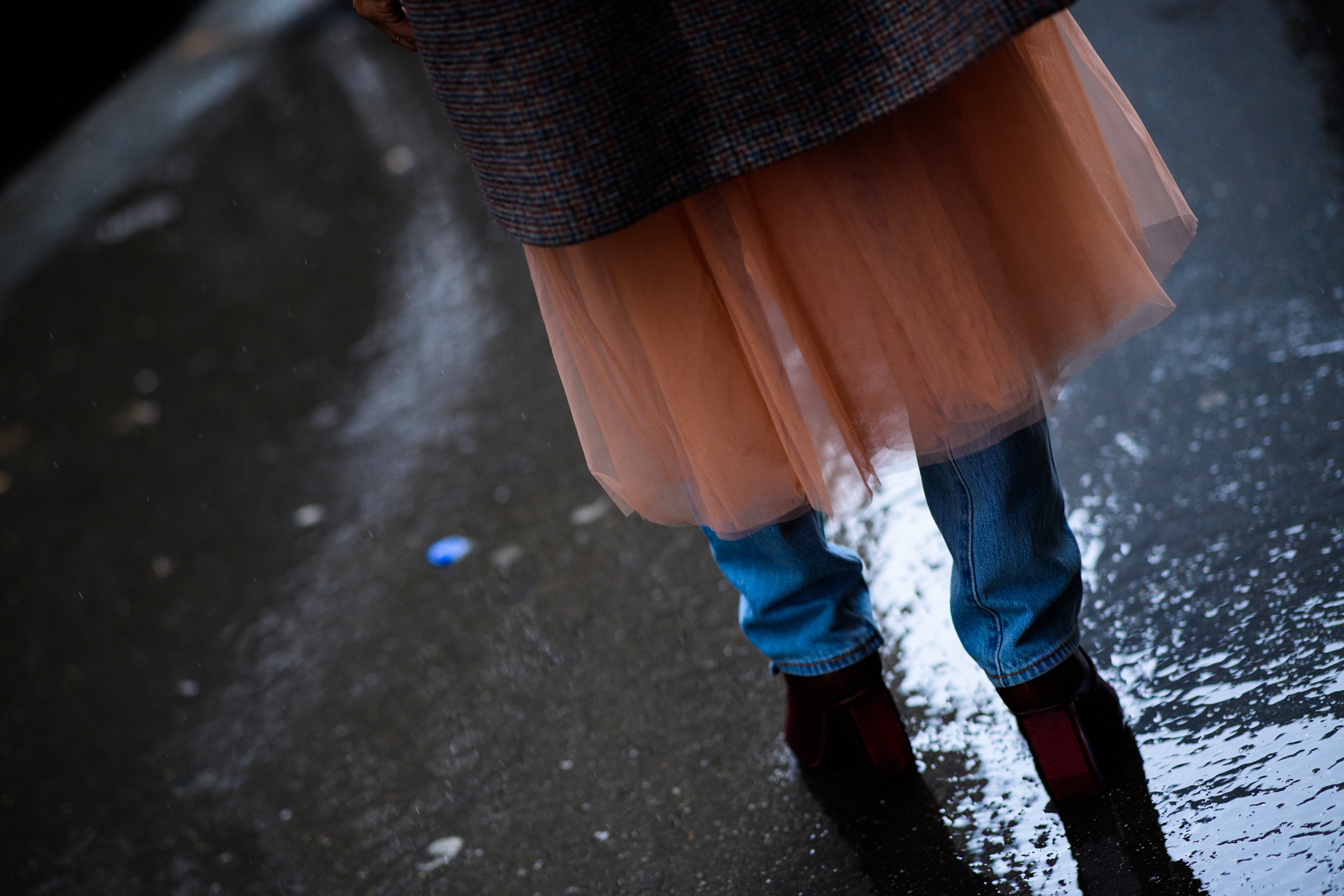 Photographer wearing tutu skirt over denim