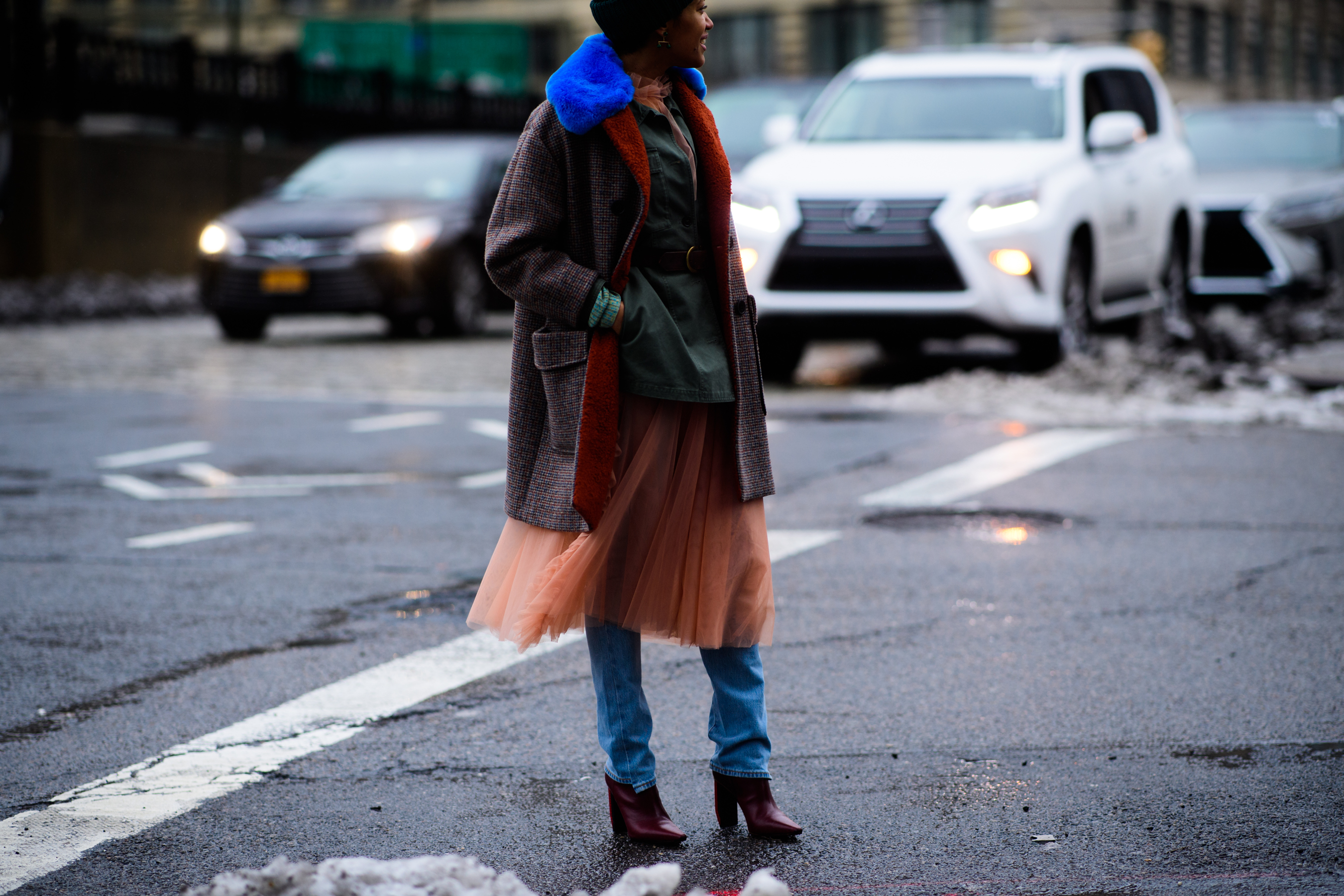 Photographer wearing tutu skirt over denim