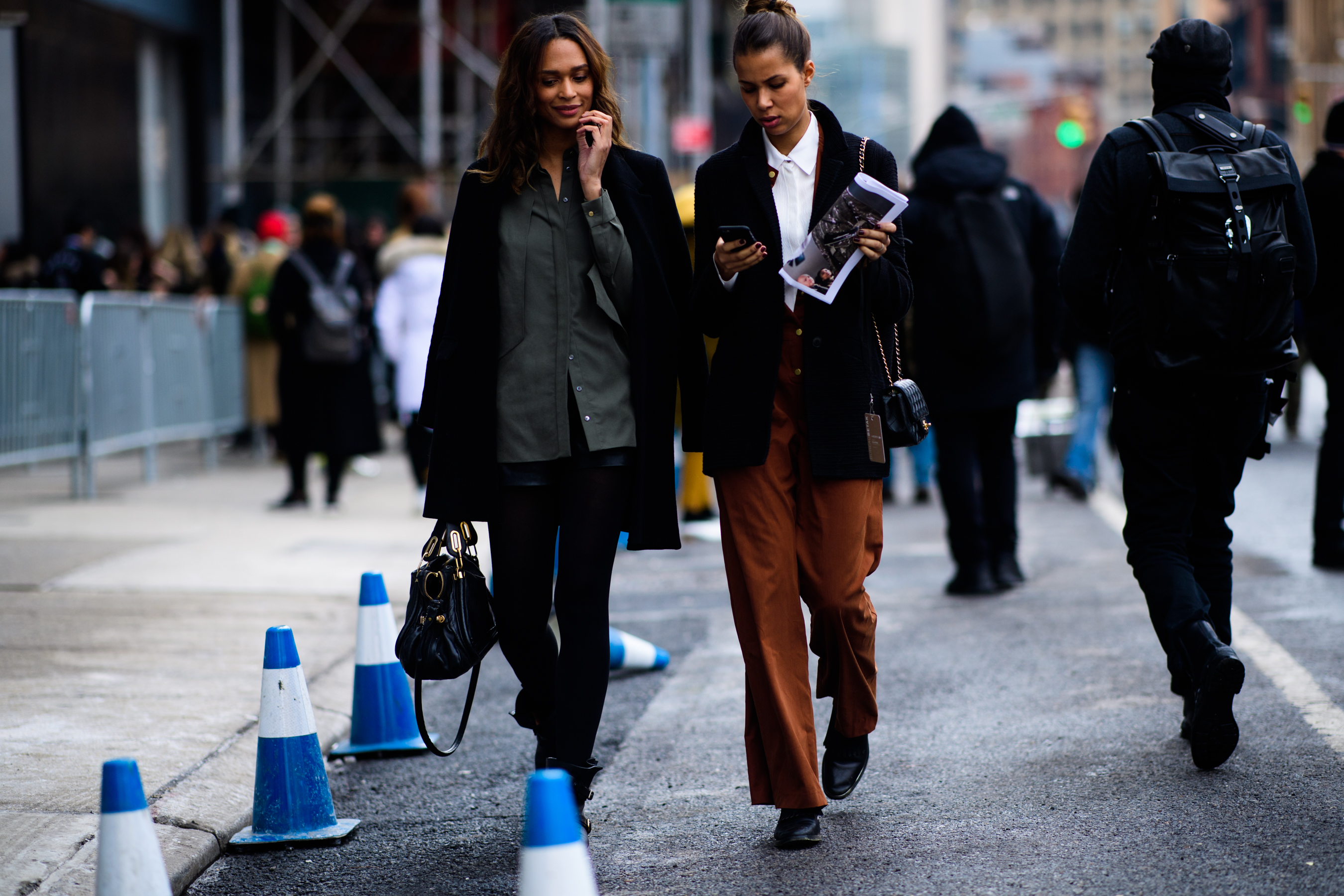Women wearing black coats