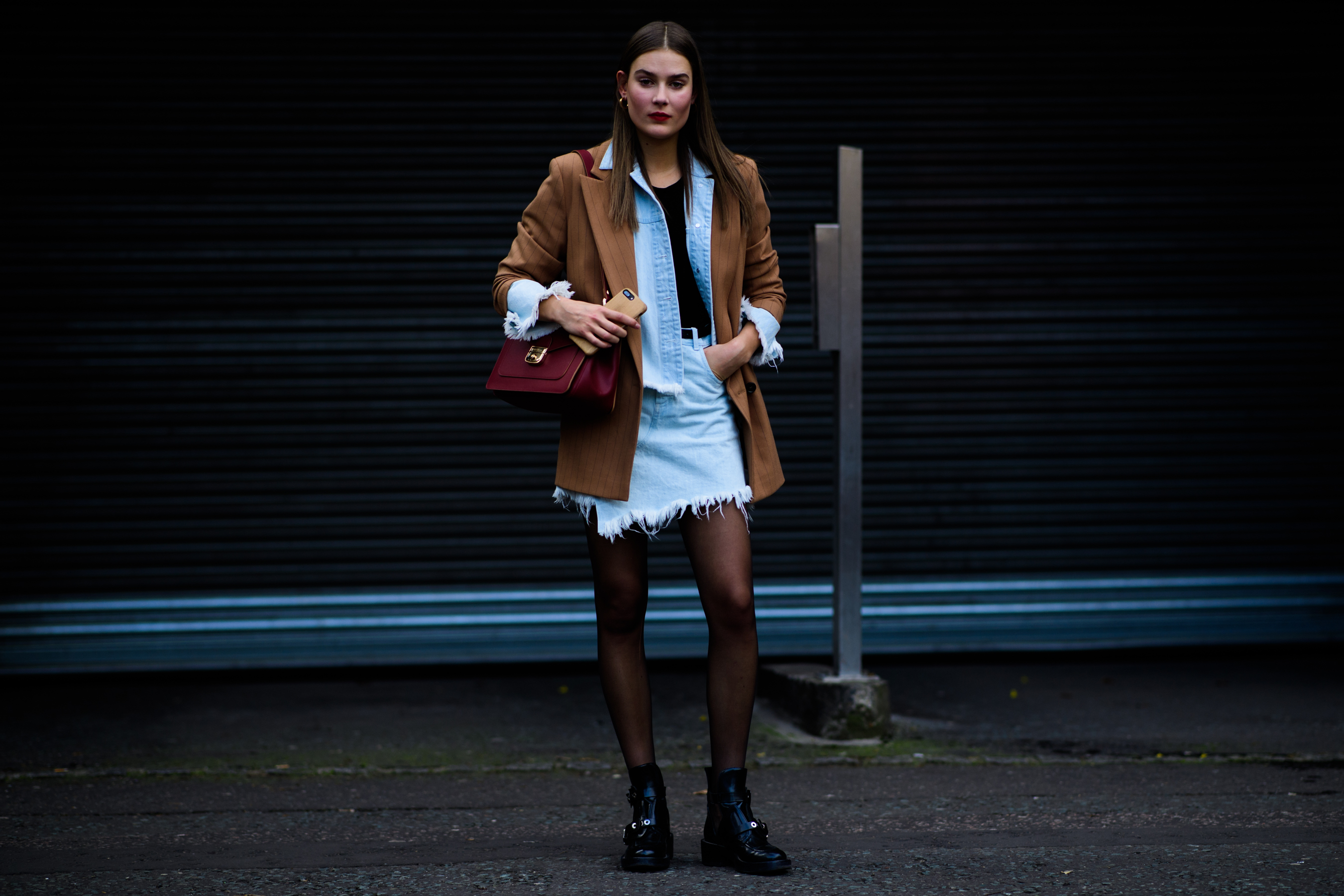 Woman wearing denim and brown clothes