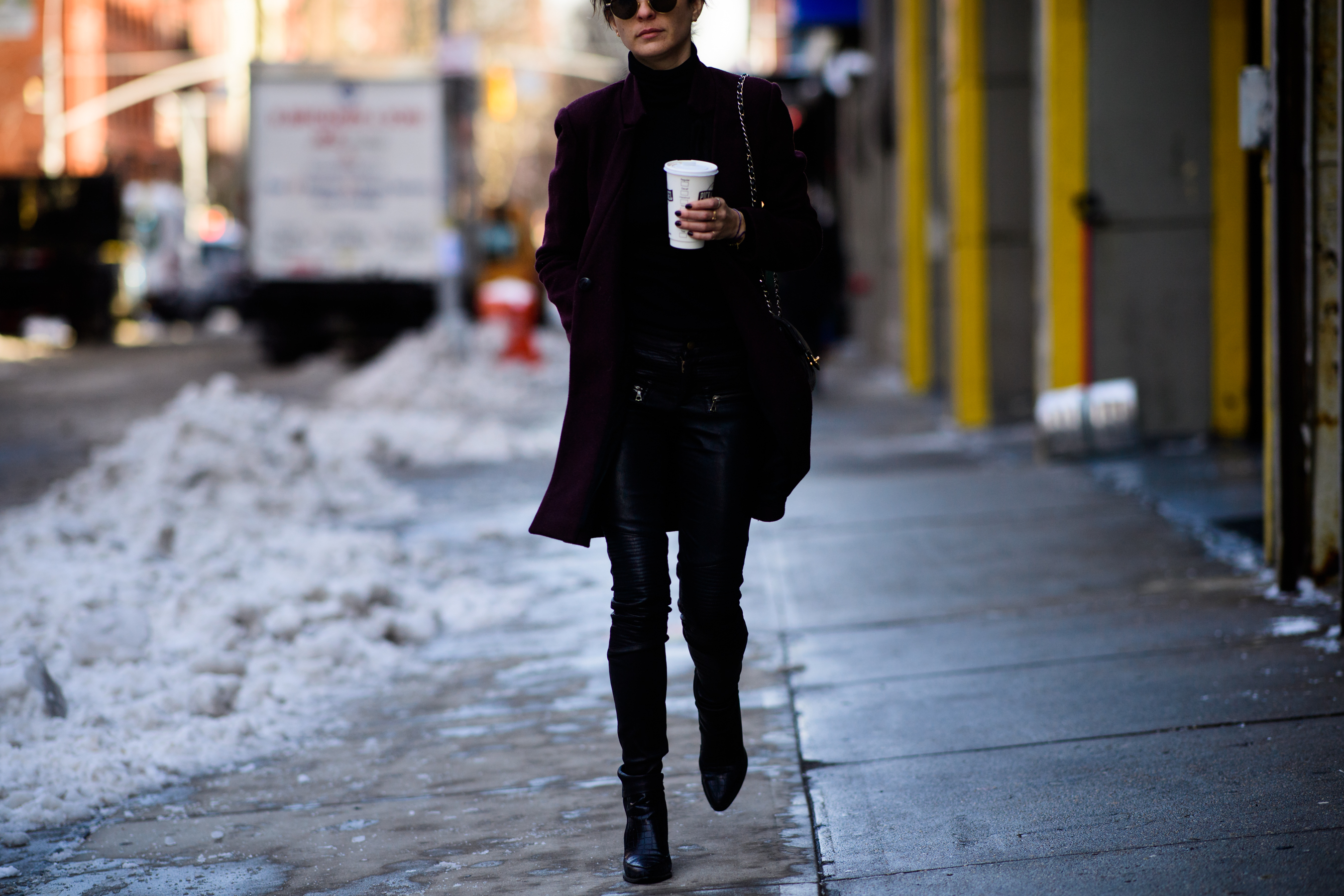 Woman wearing black clothes and black sunglasses