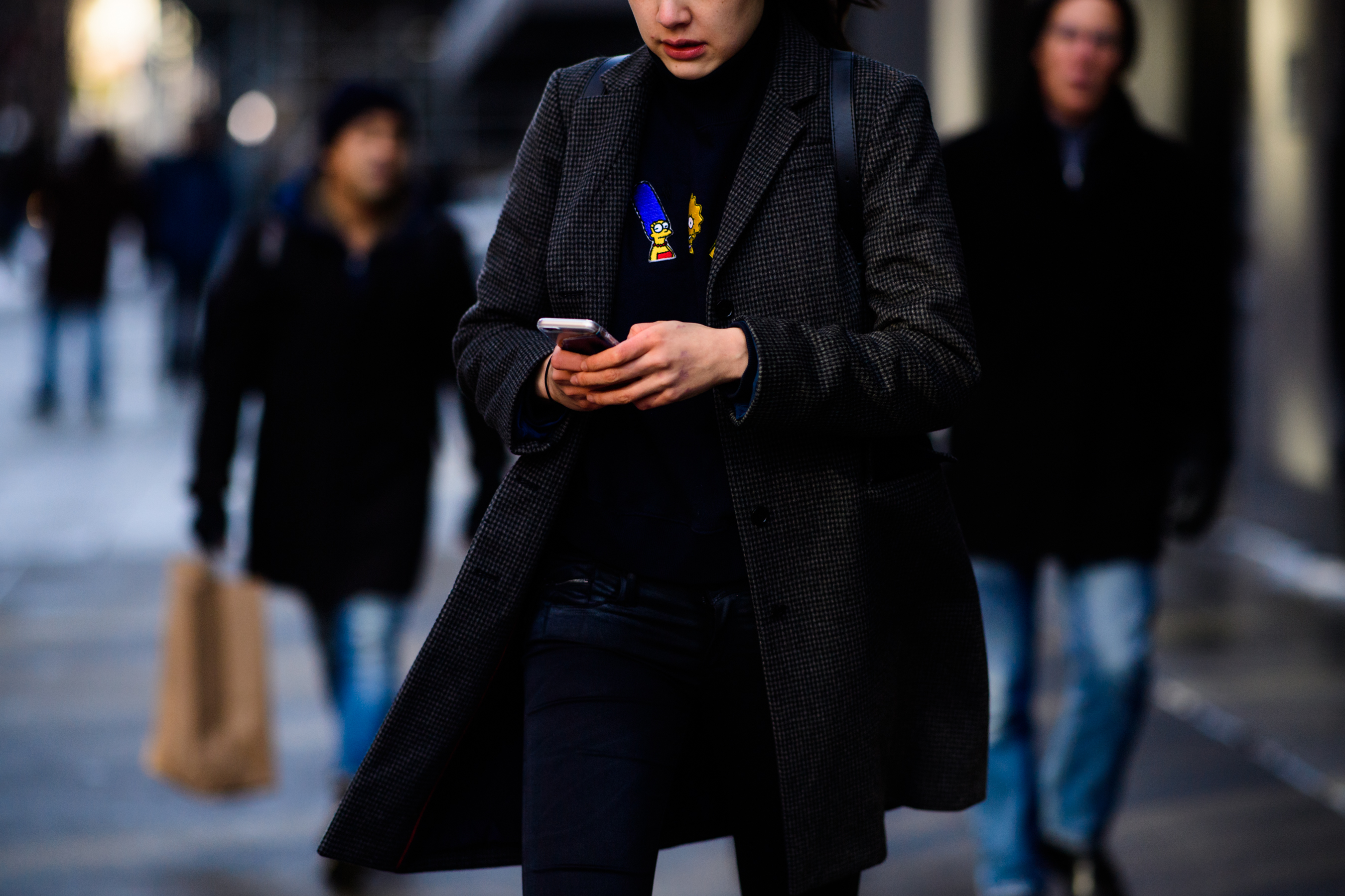 Woman wearing sweater with Simpsons prints