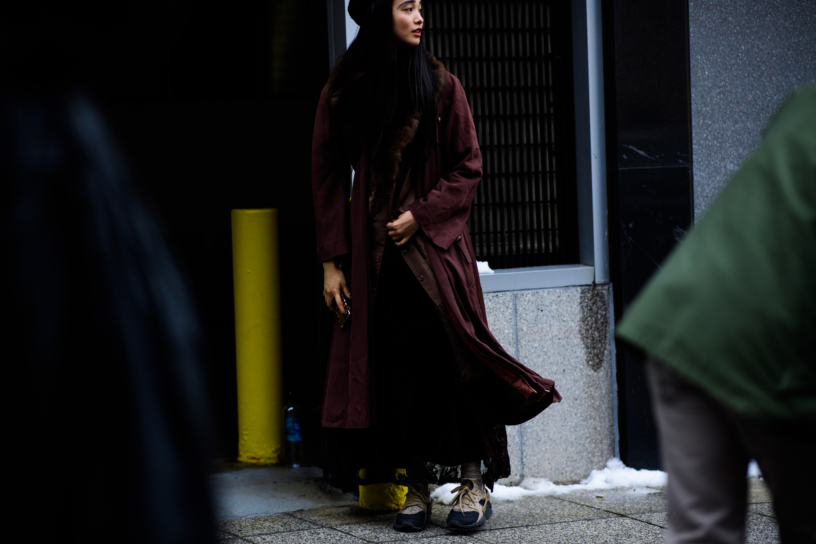 Model wearing long cloak