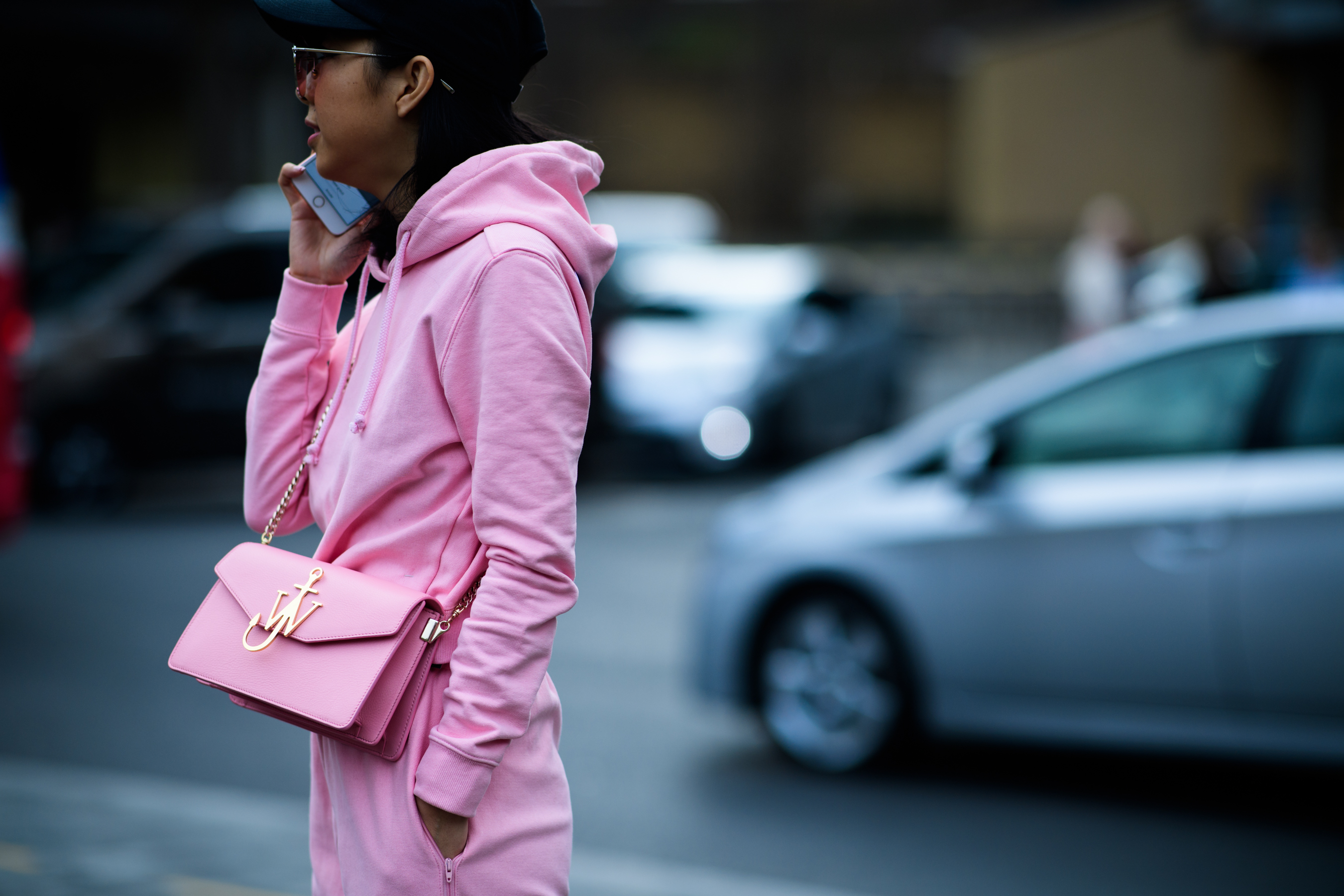 Woman wearing pink clothes and J.W.Anderson bag
