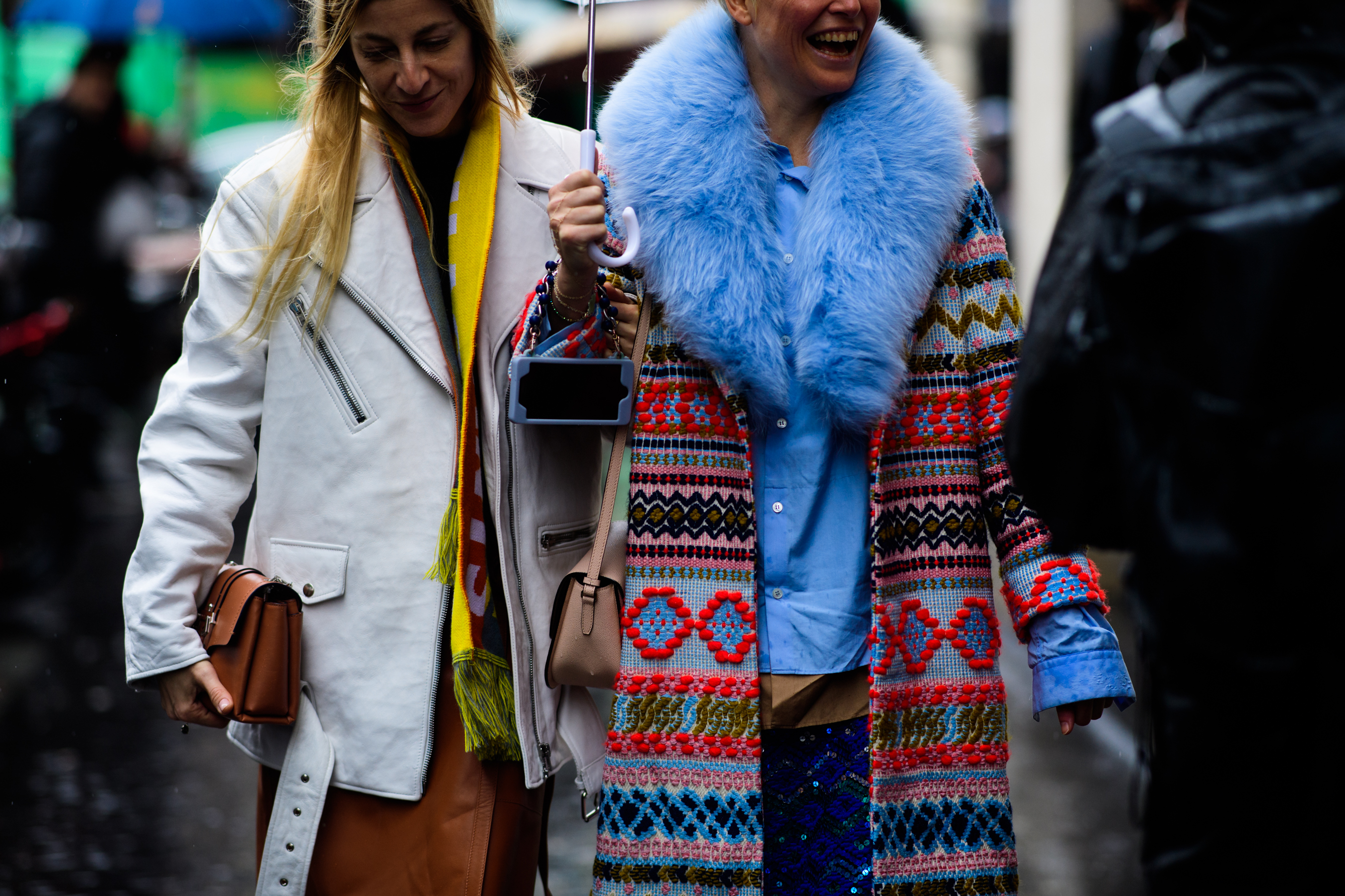 Two women wearing colourful clothes