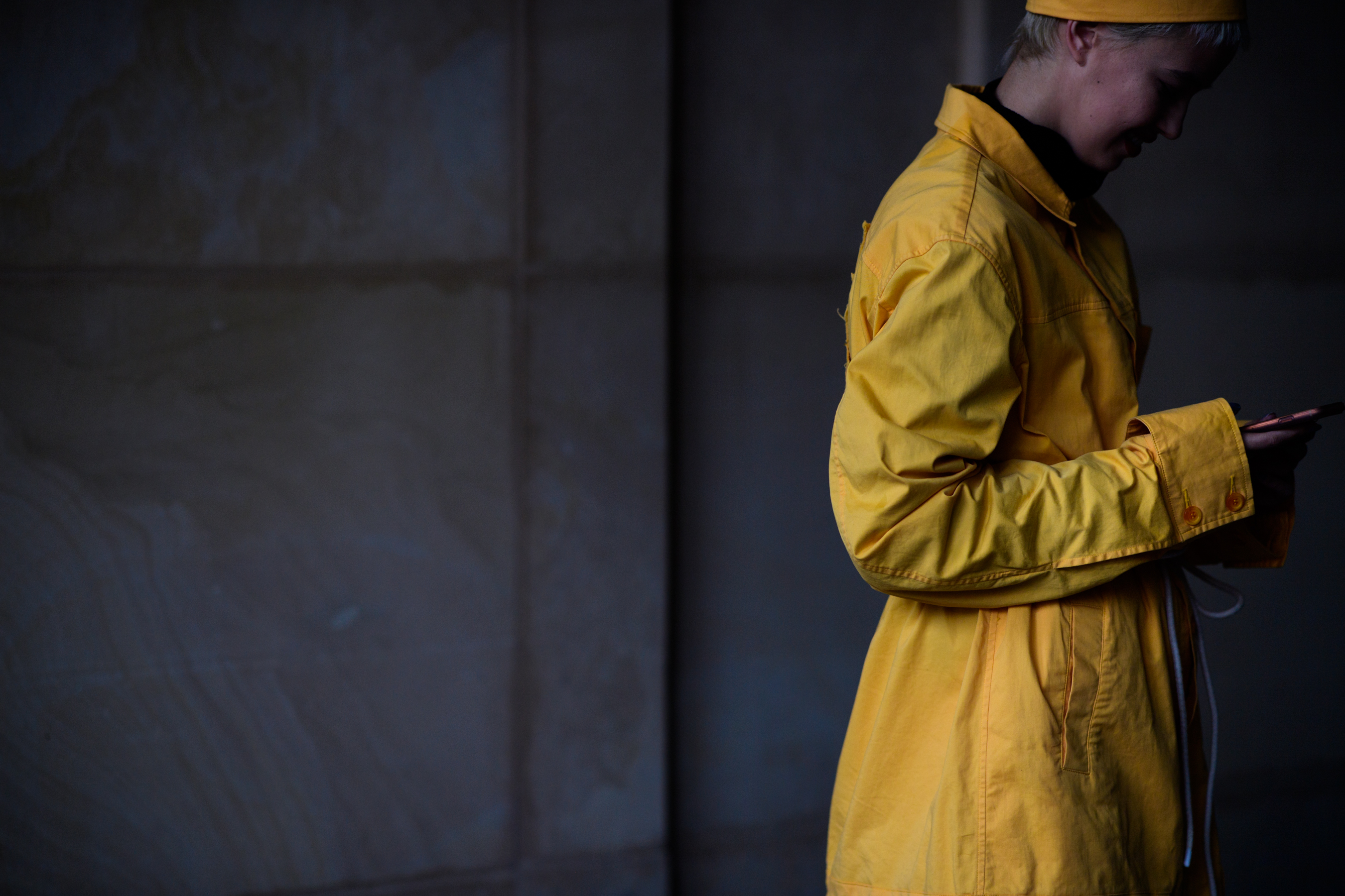Woman wearing yellow coat