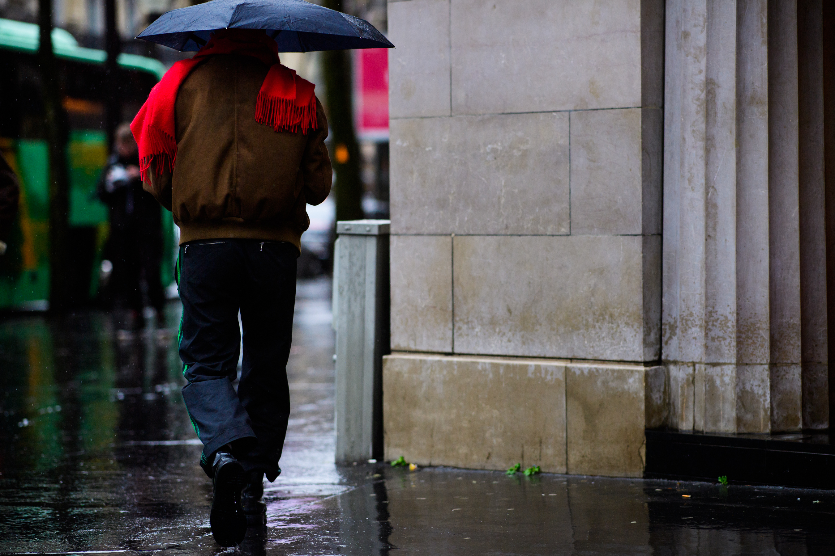 Man wearing brown bomber jacket