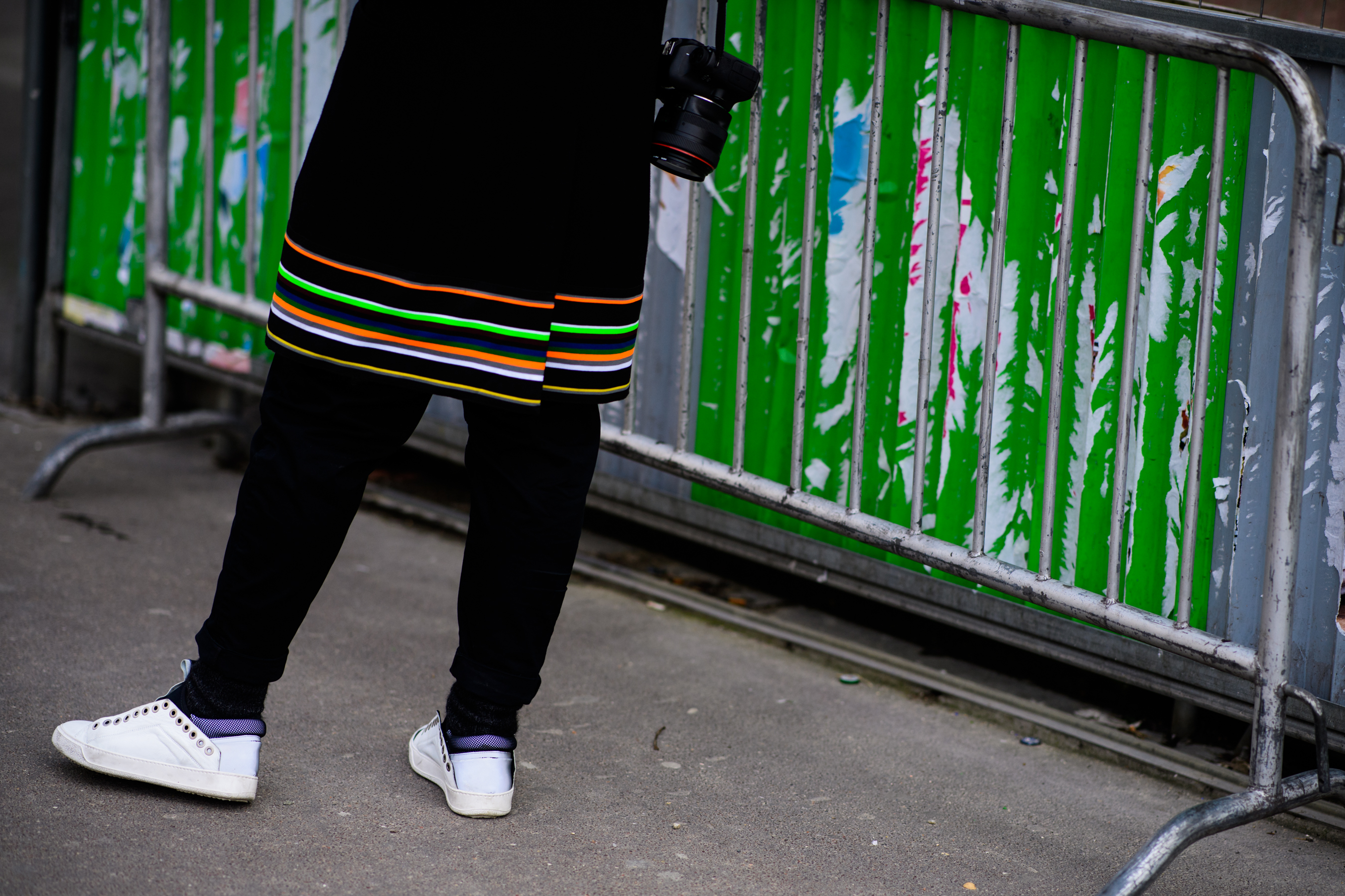 Photographer wearing Raf Simons coat