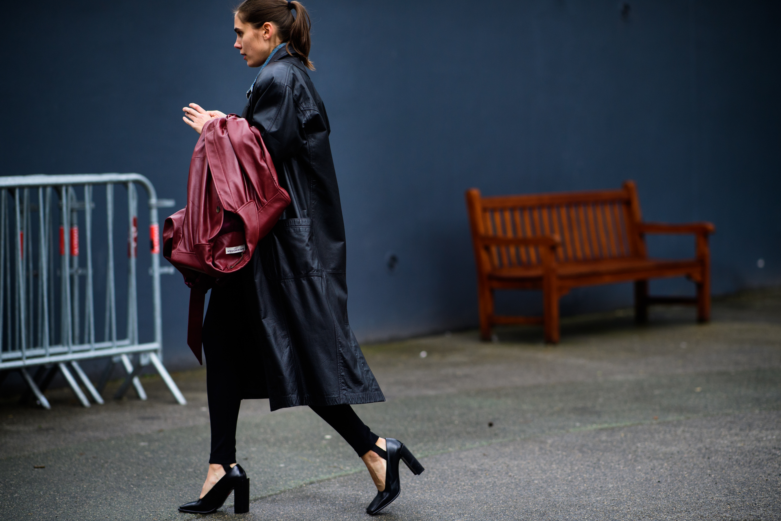 Woman wearing black leather coat