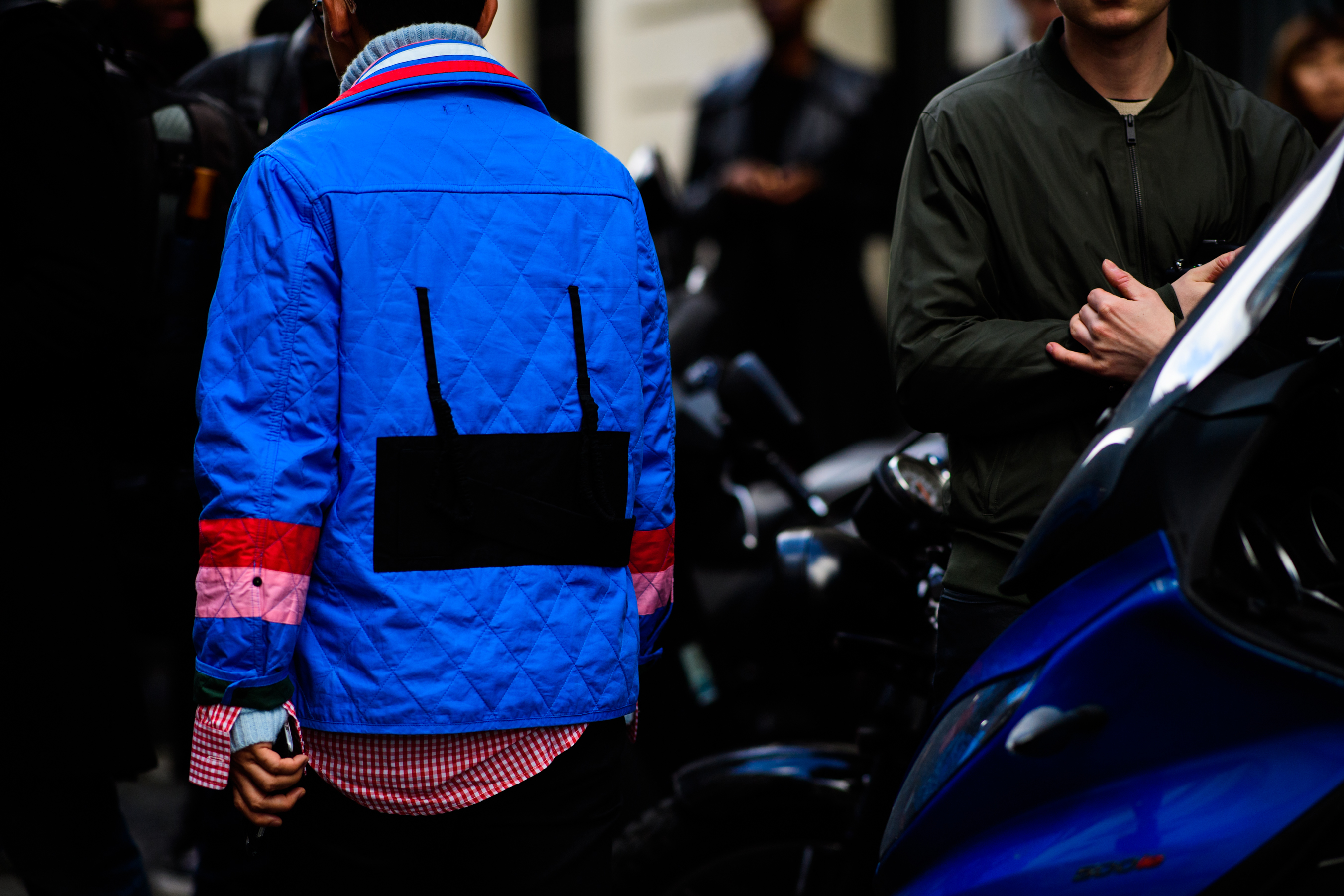 Man wearing stitched blue jacket