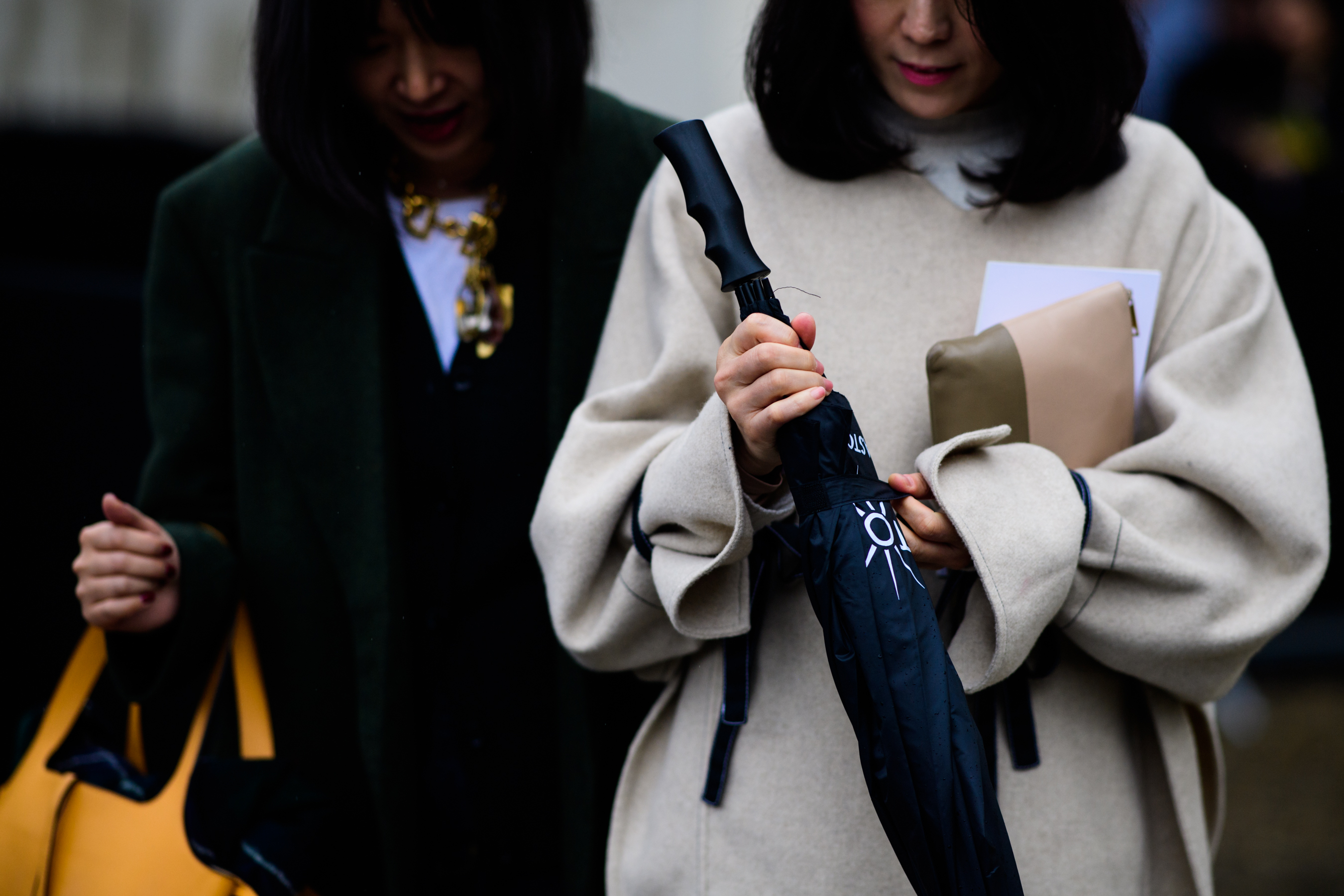 Two women wearing cashmere coats