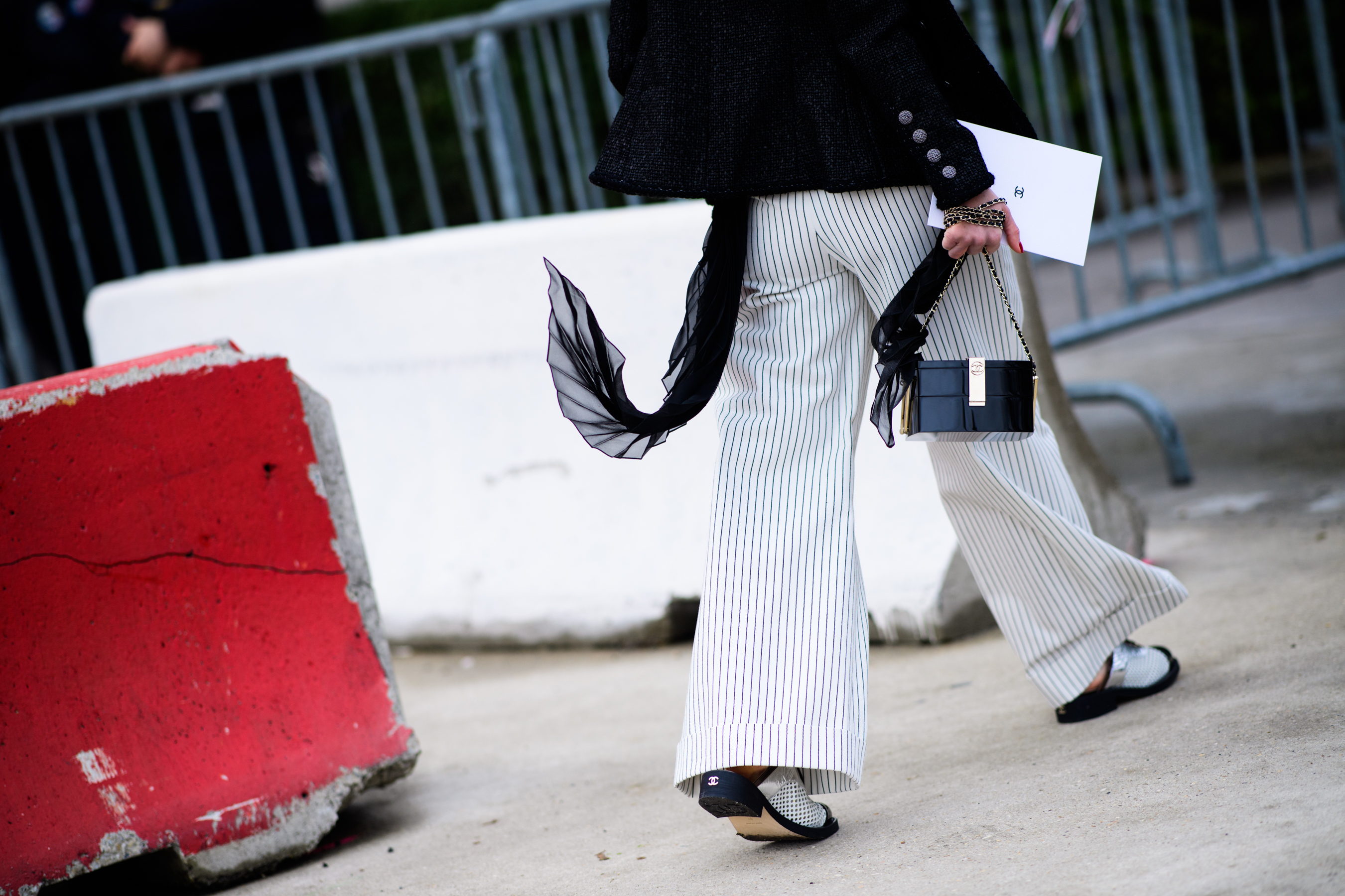 Woman wearing Chanel sliders