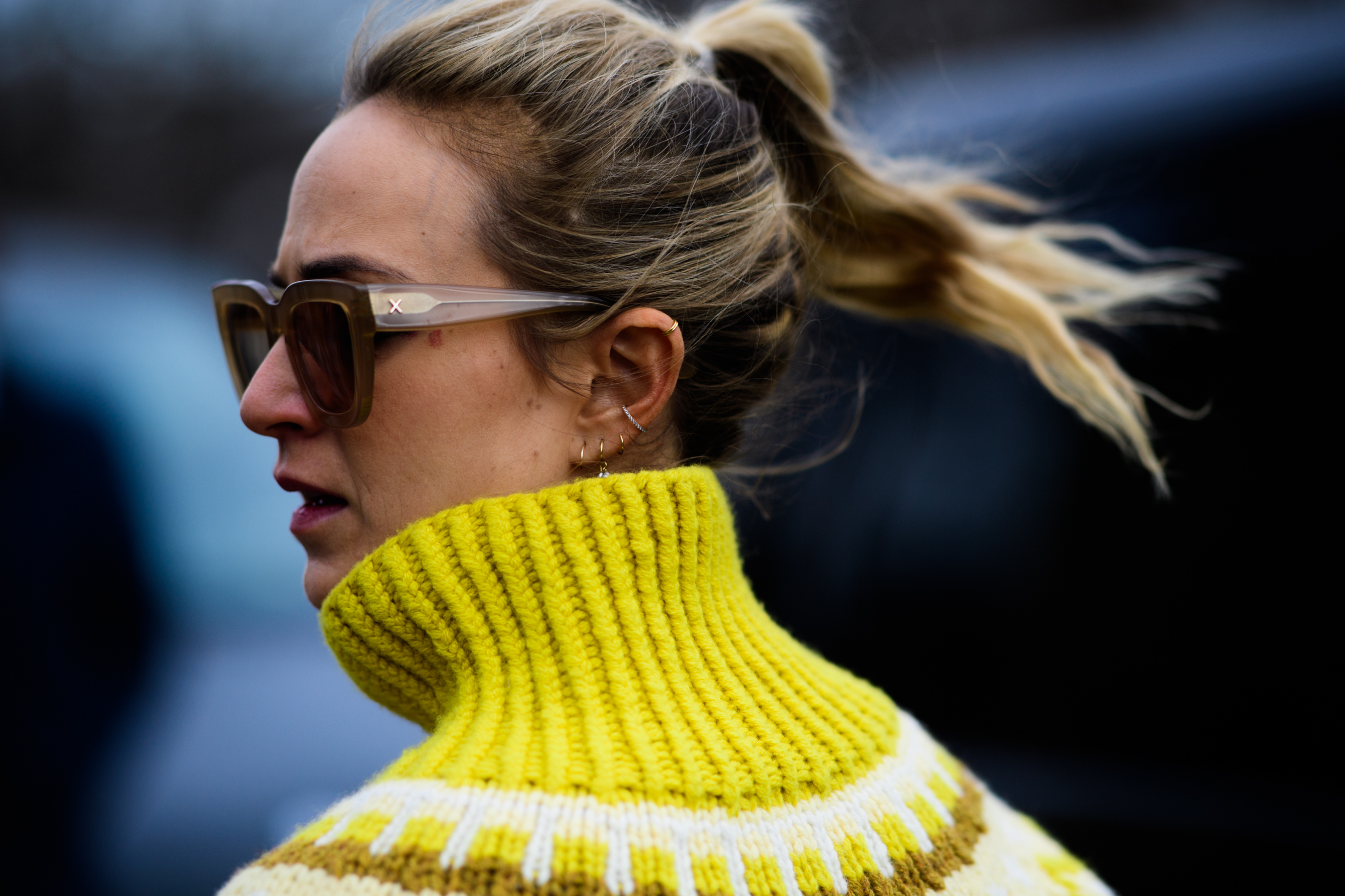 Woman wearing glasses and yellow sweater