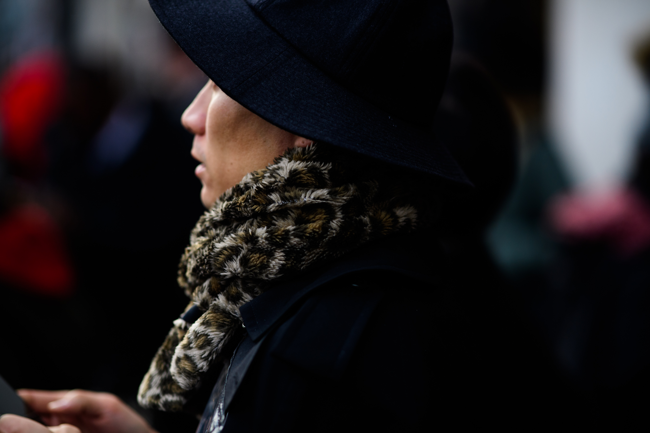 Man wearing animal printed scarf