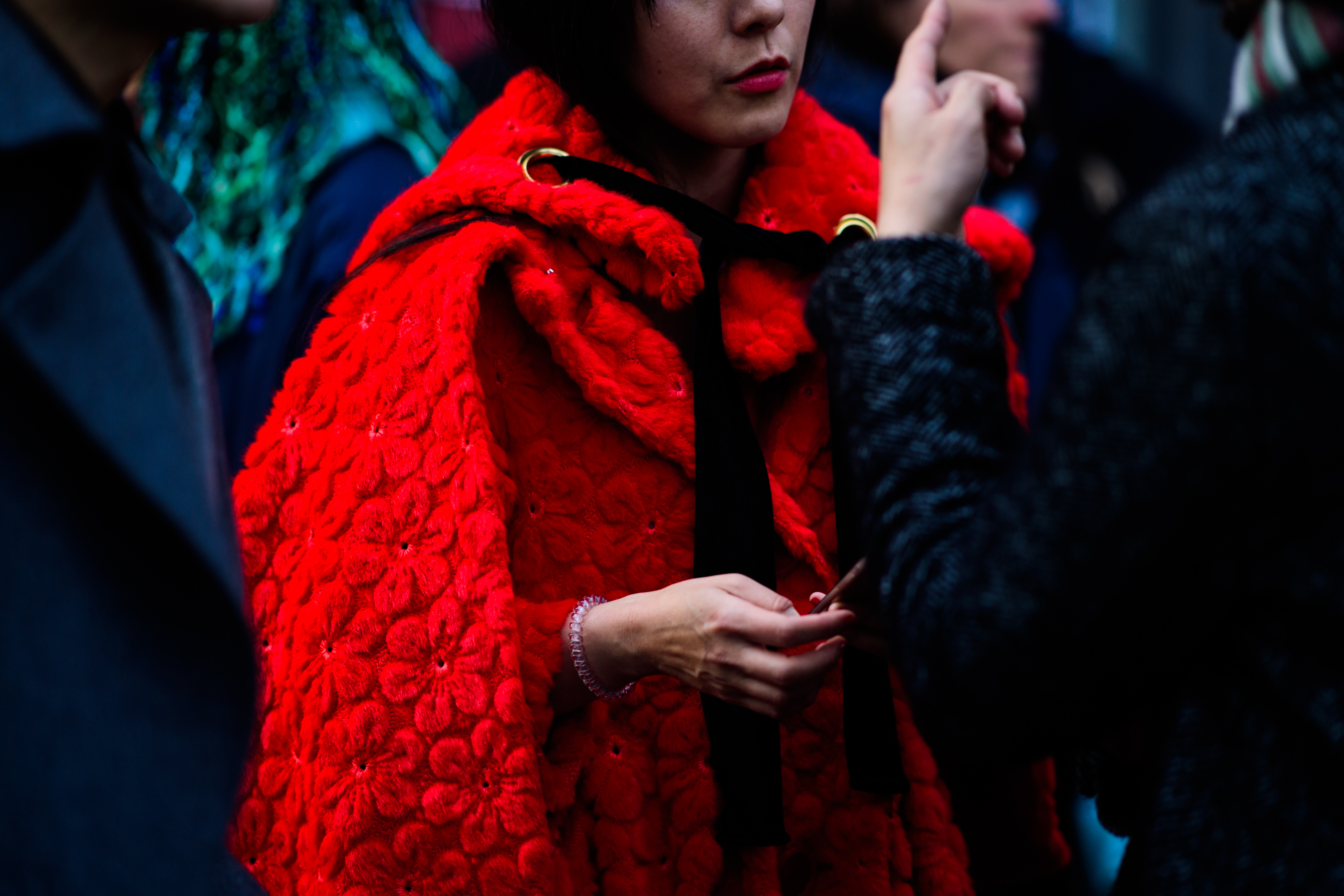 Woman wearing red floral coat