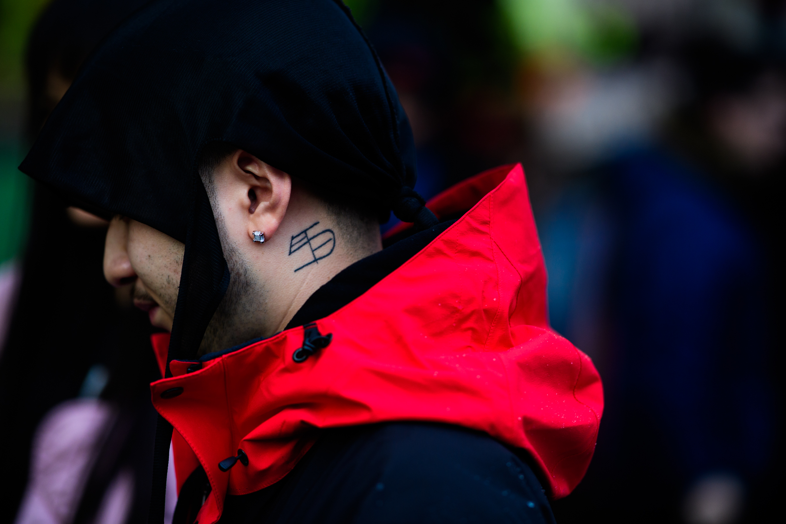 Man wearing jacket with red hood