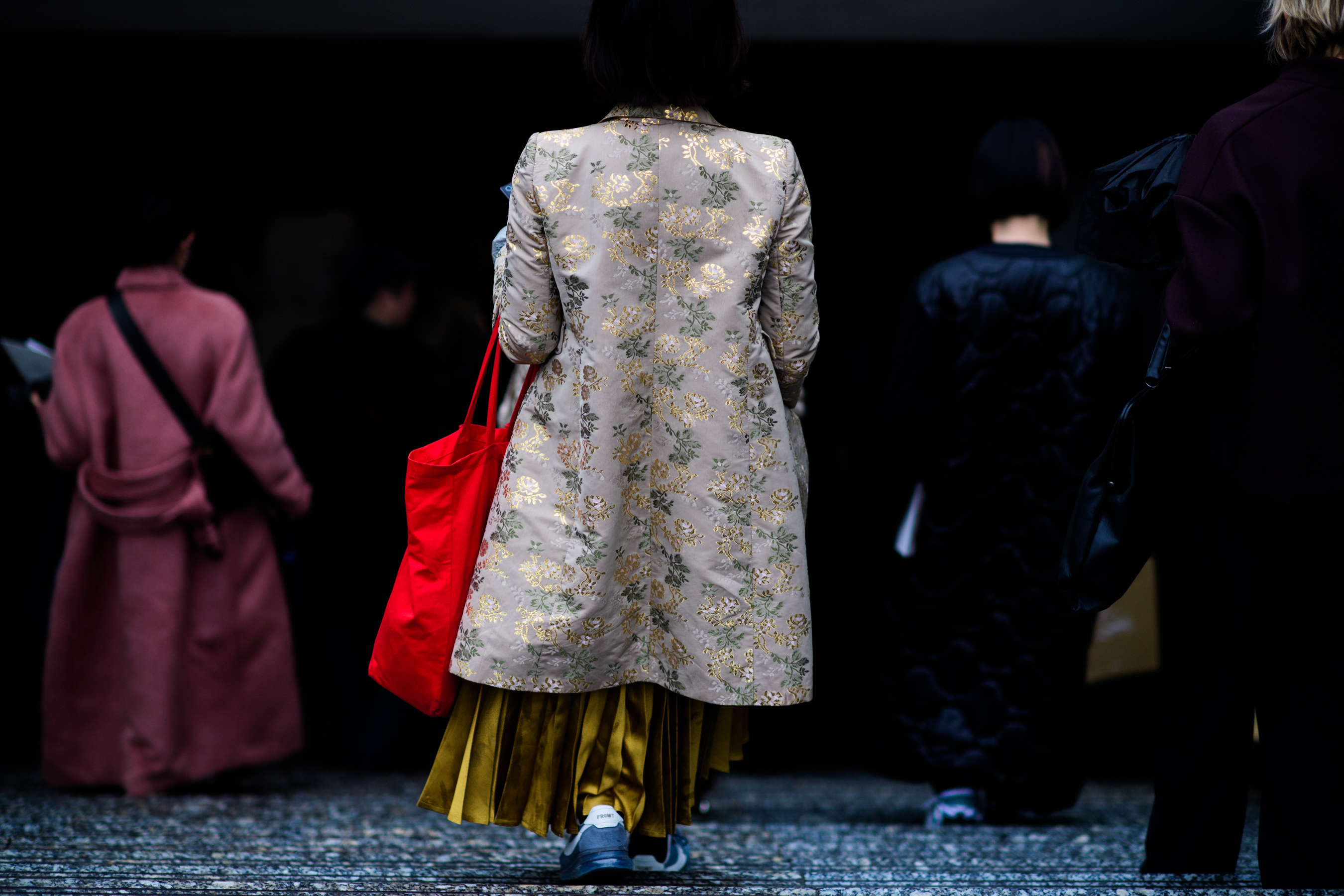 Woman wearing kimono style embroidered coat