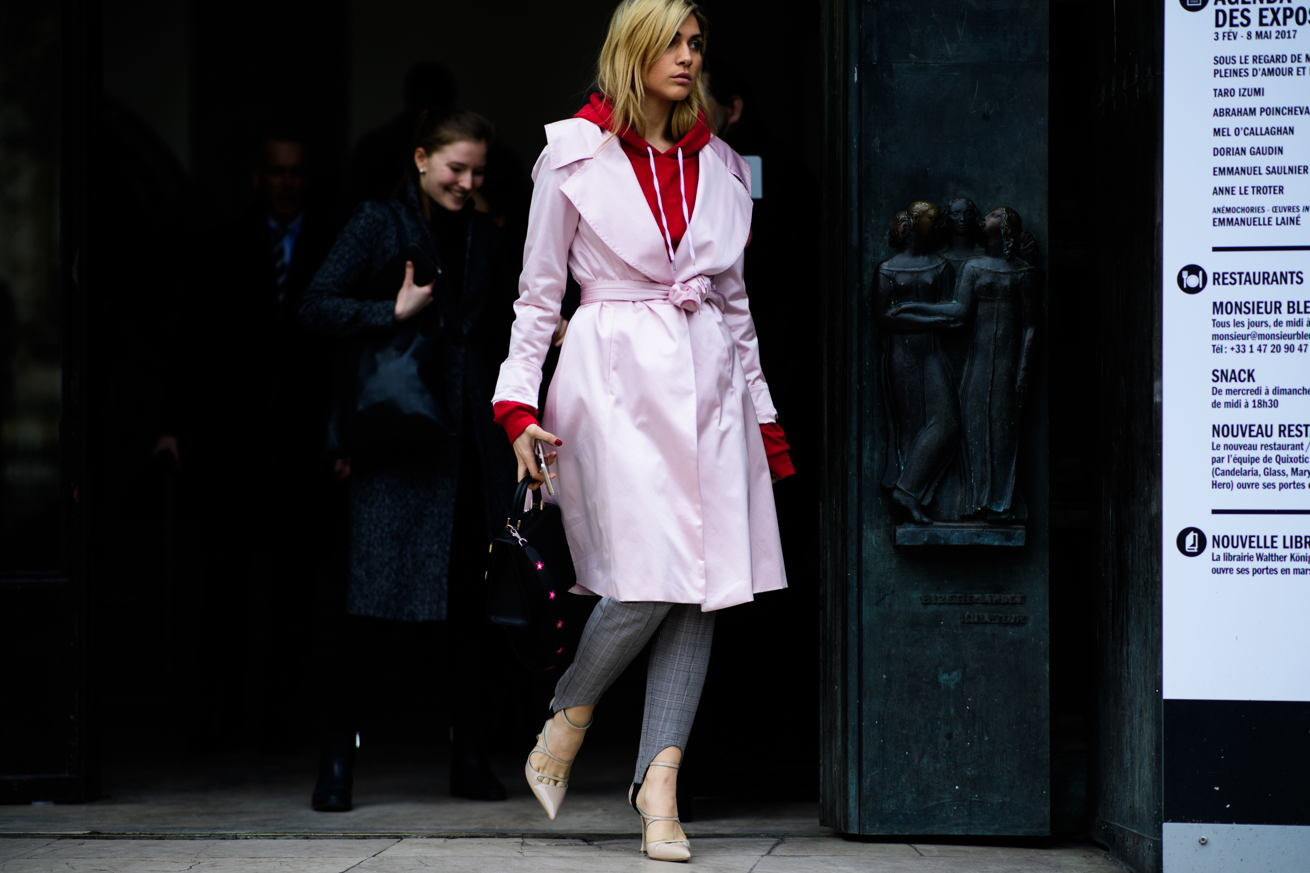 Woman wearing pink coat after the show