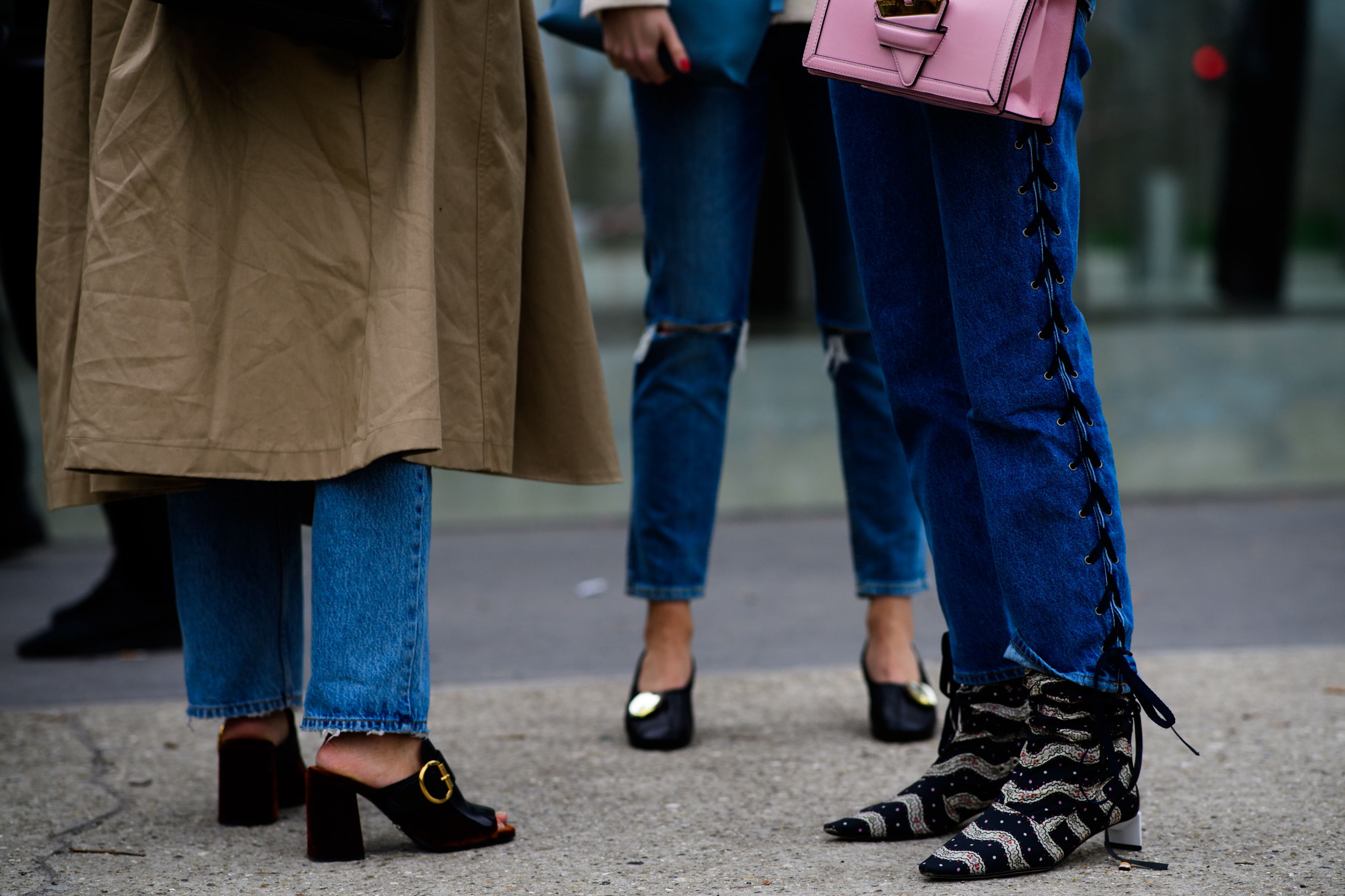 Two women wearing boots and mules