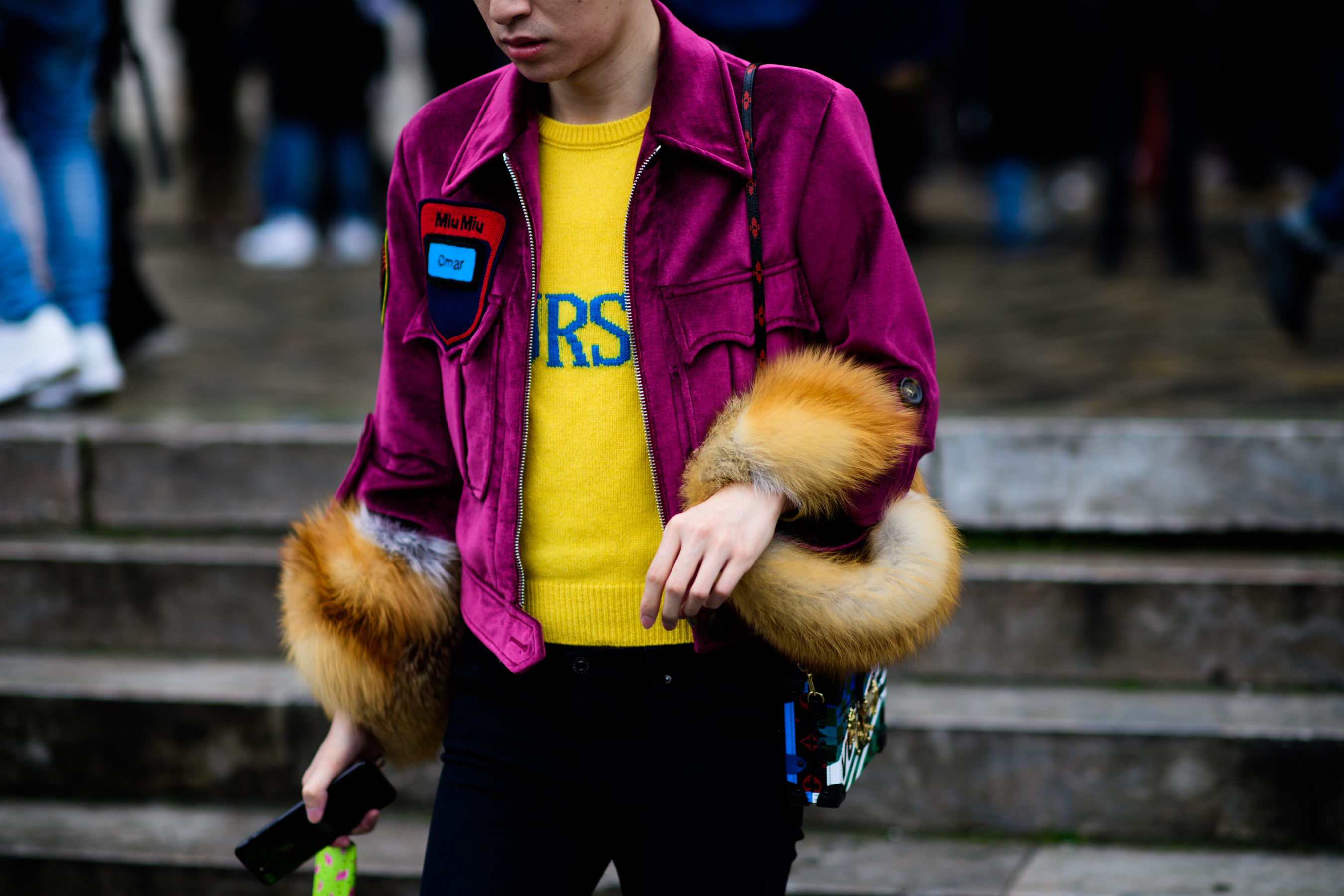 Man wearing pink velvet Miu Miu coat