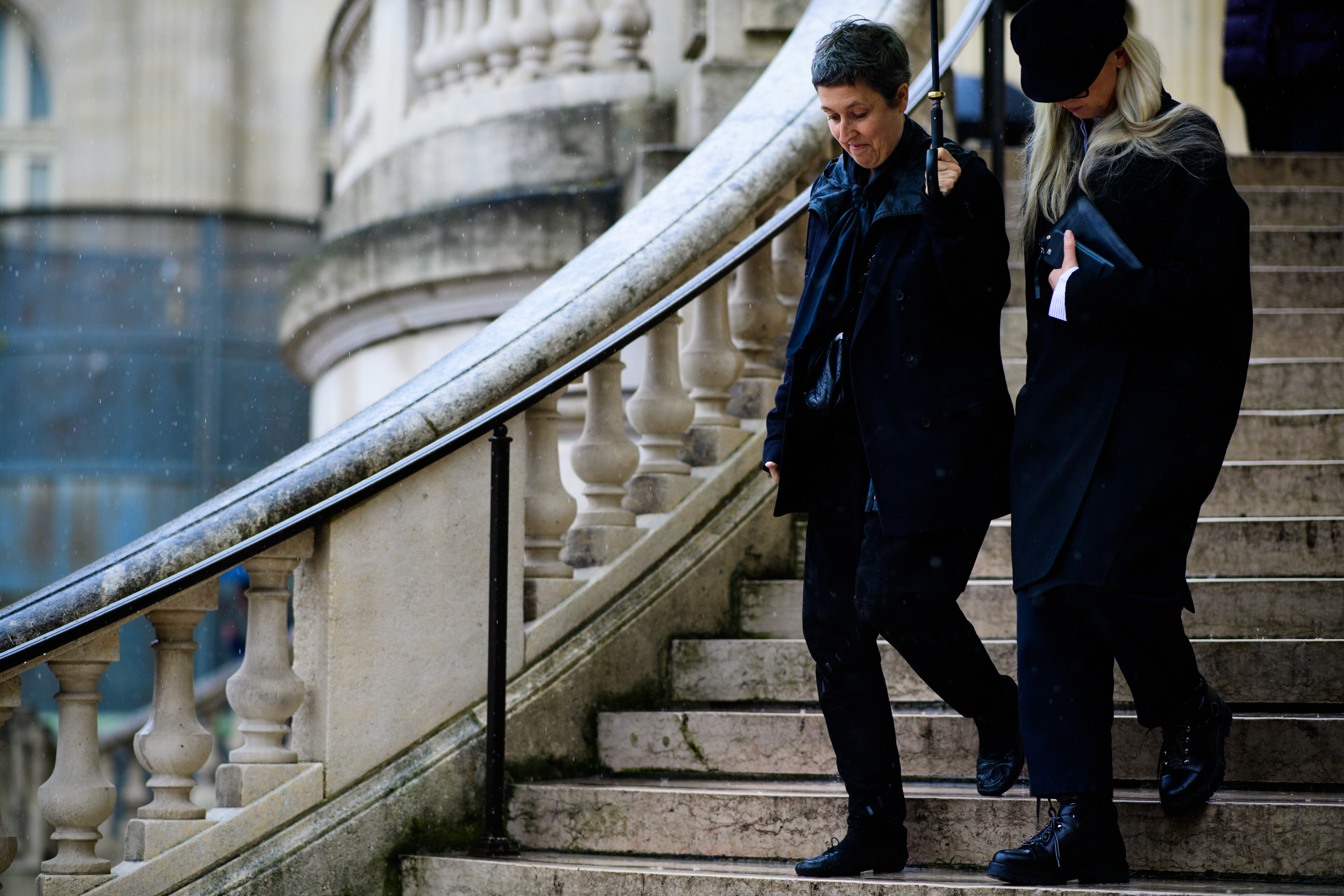 Two women wearing all black