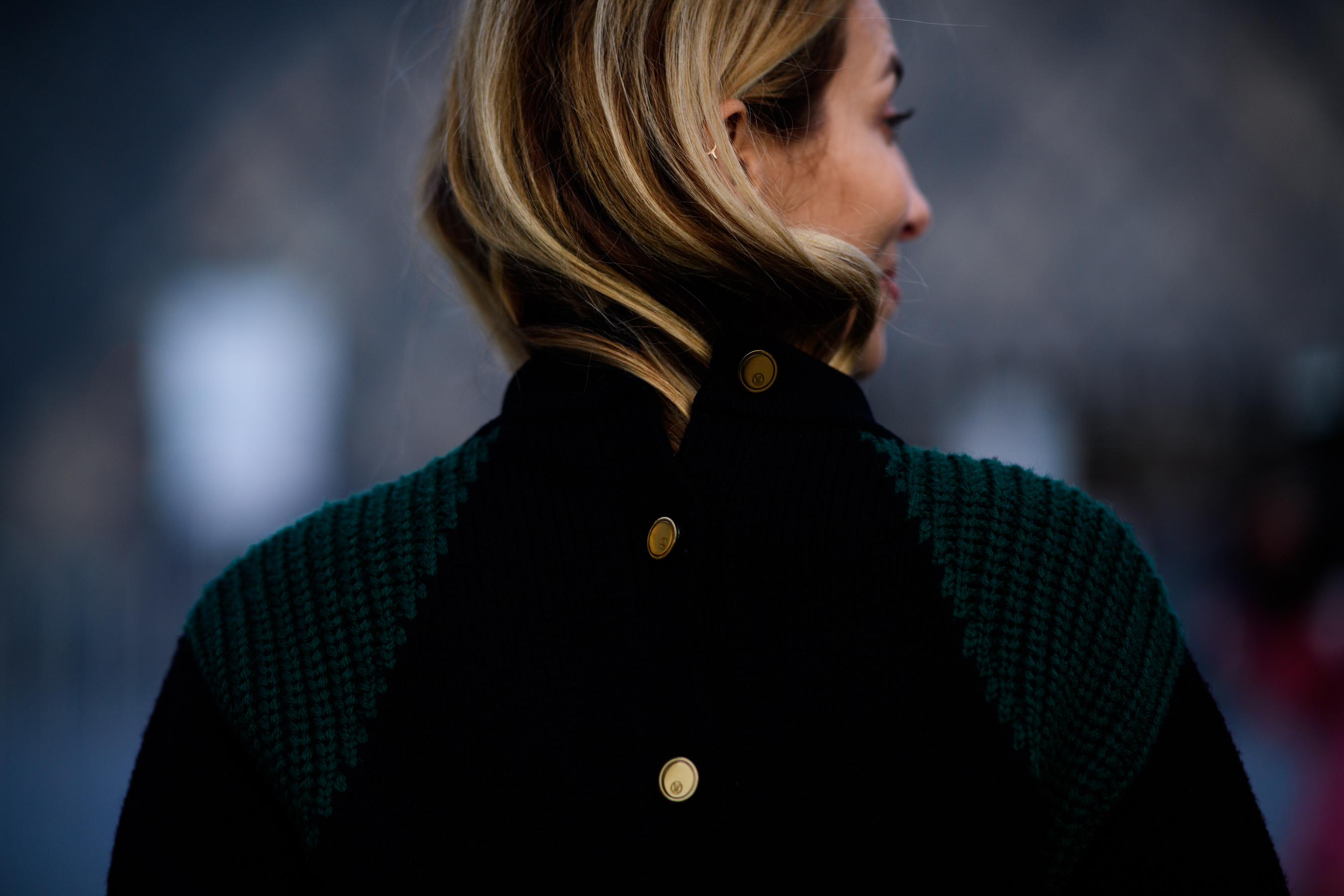 Presenter wearing Louis Vuitton sweater