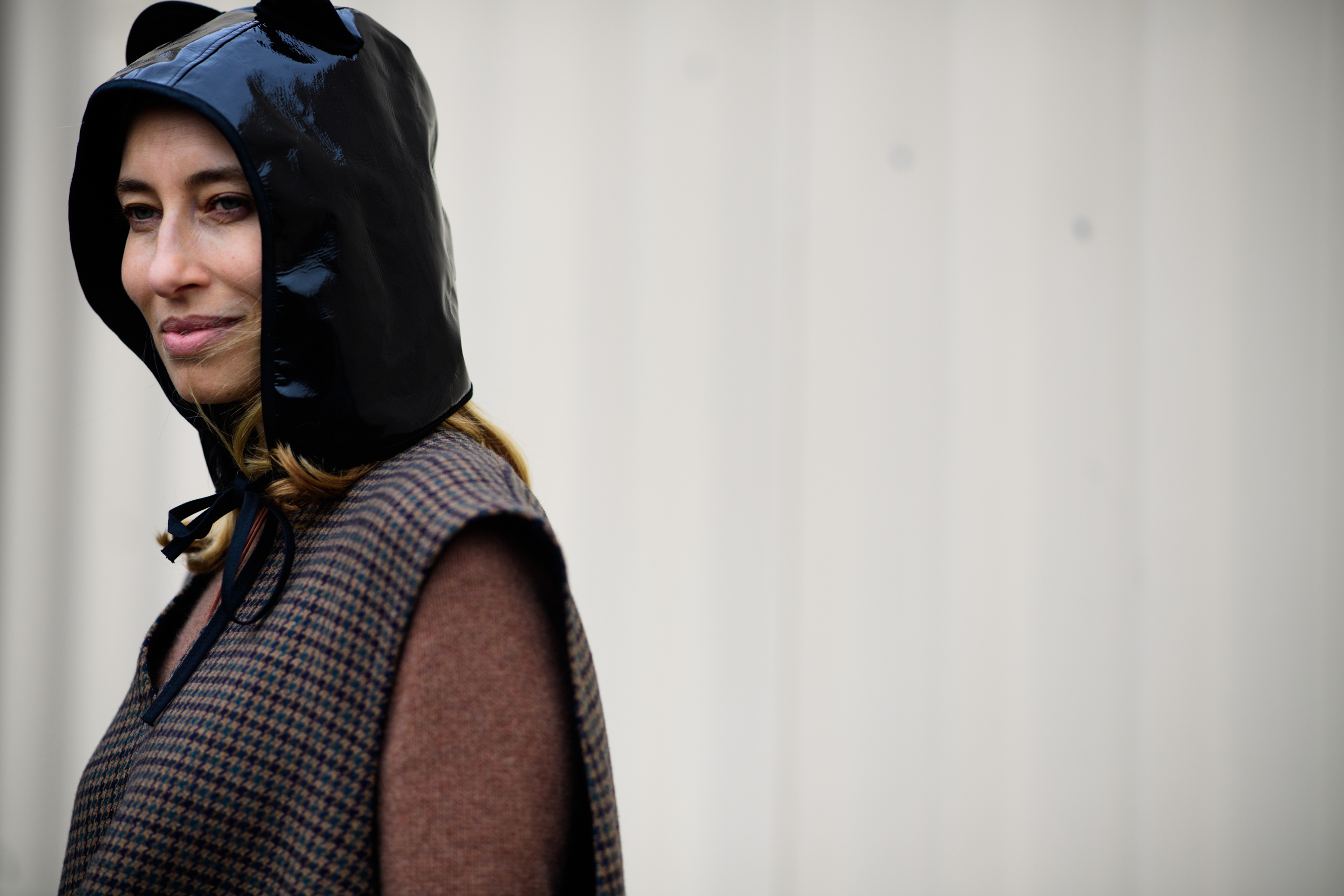 Woman wearing leather hat with ears
