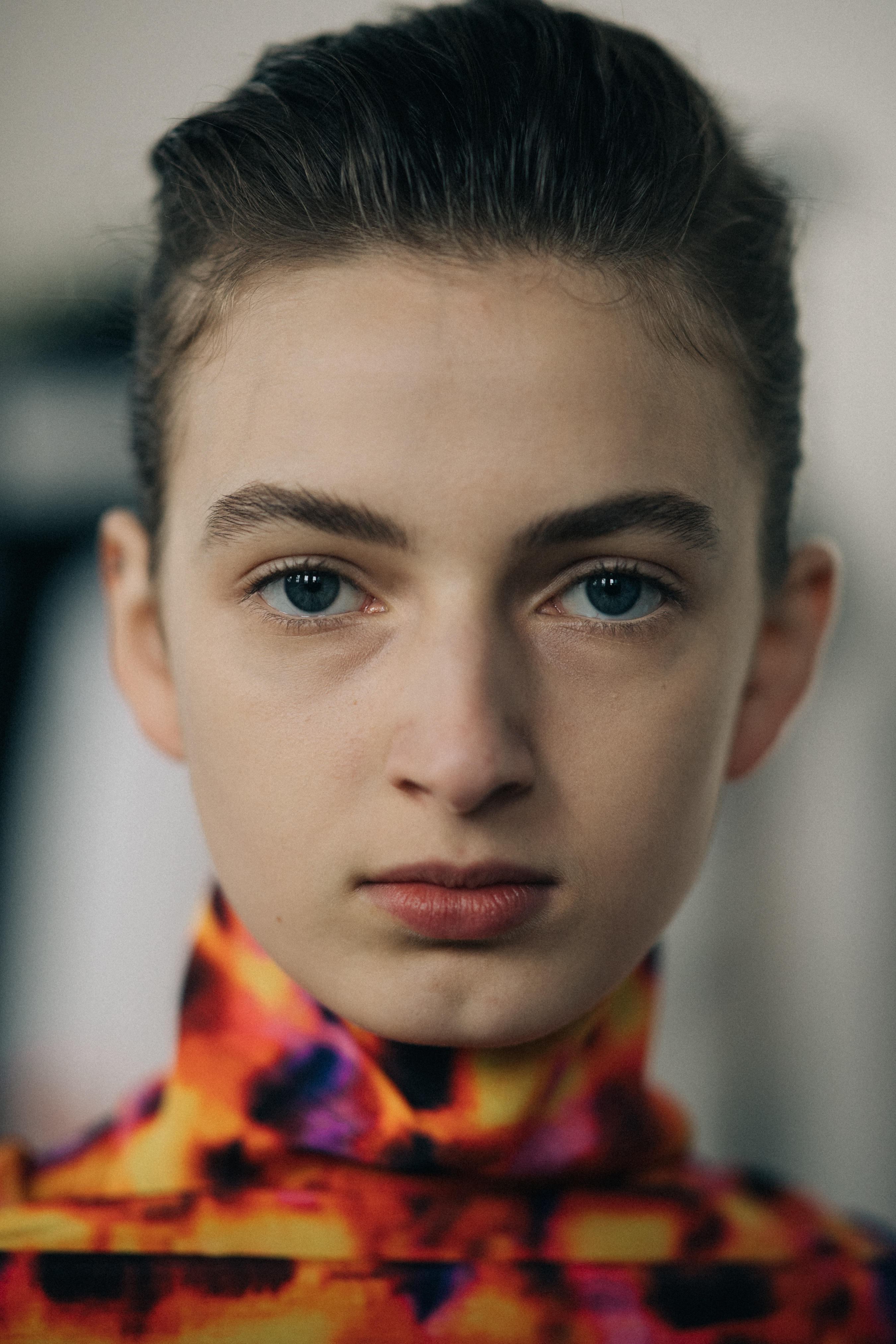 Portrait of a model wearing orange dress