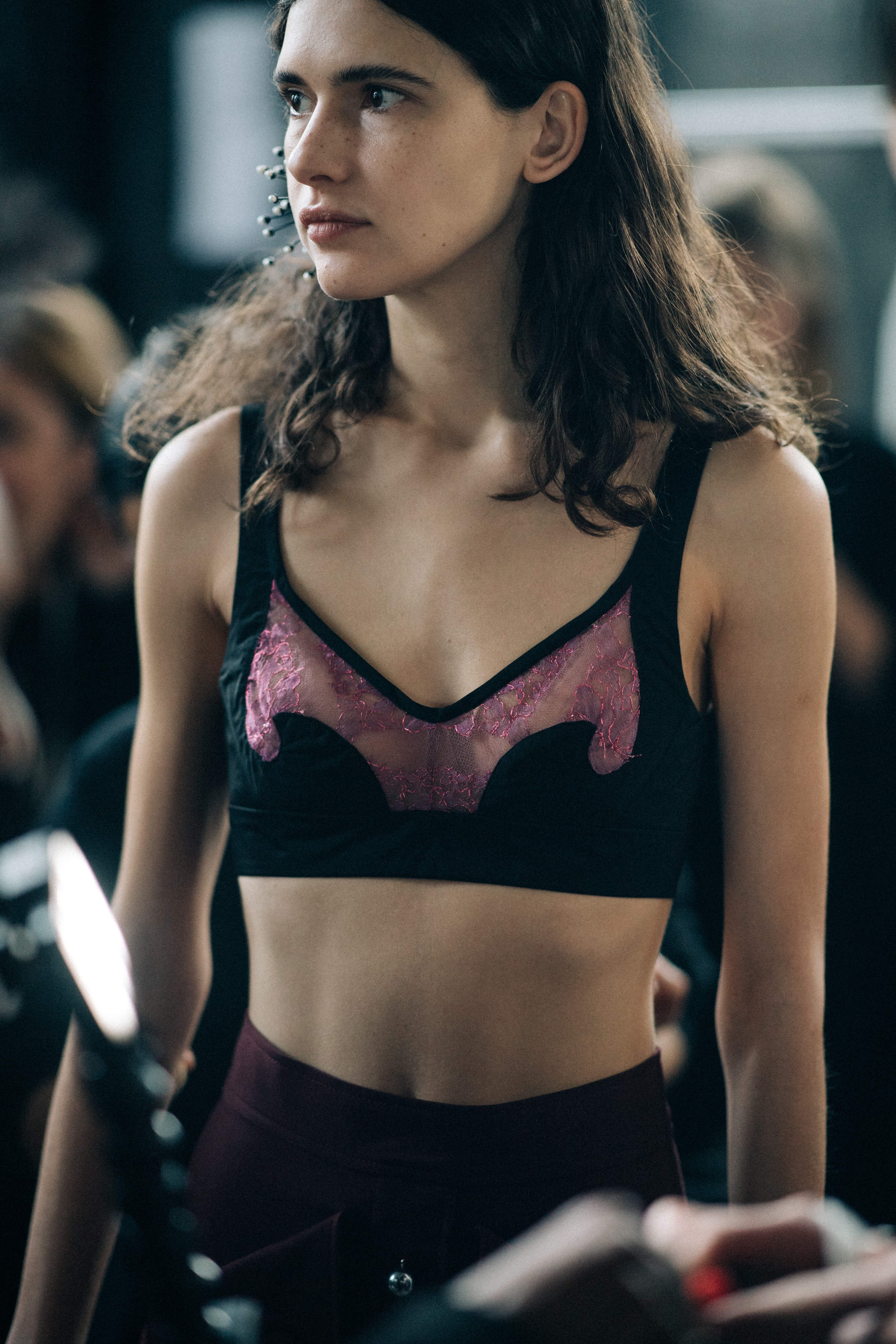 Model Iana Godnia wearing sport top