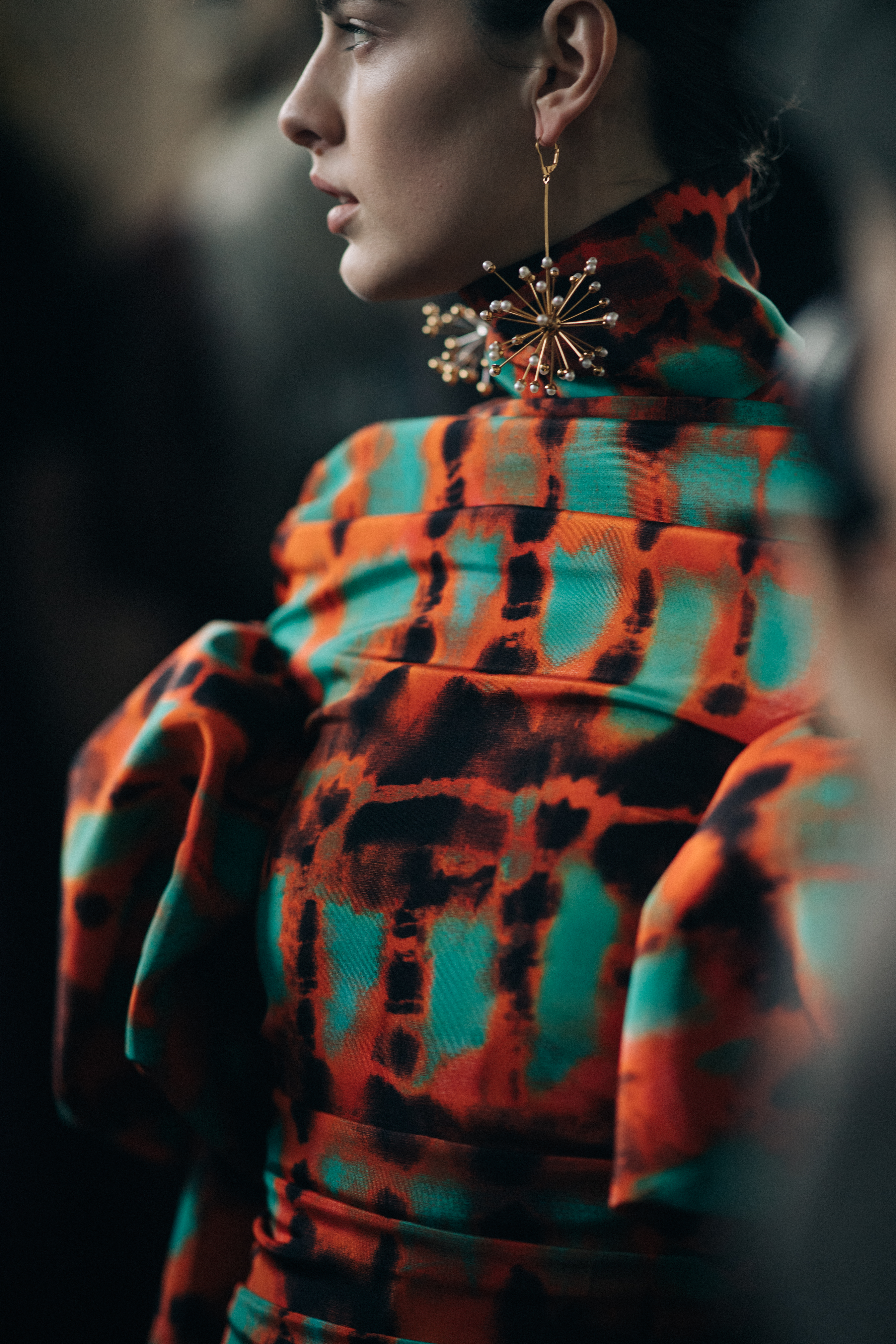 Model Marie Damian wearing orange dress