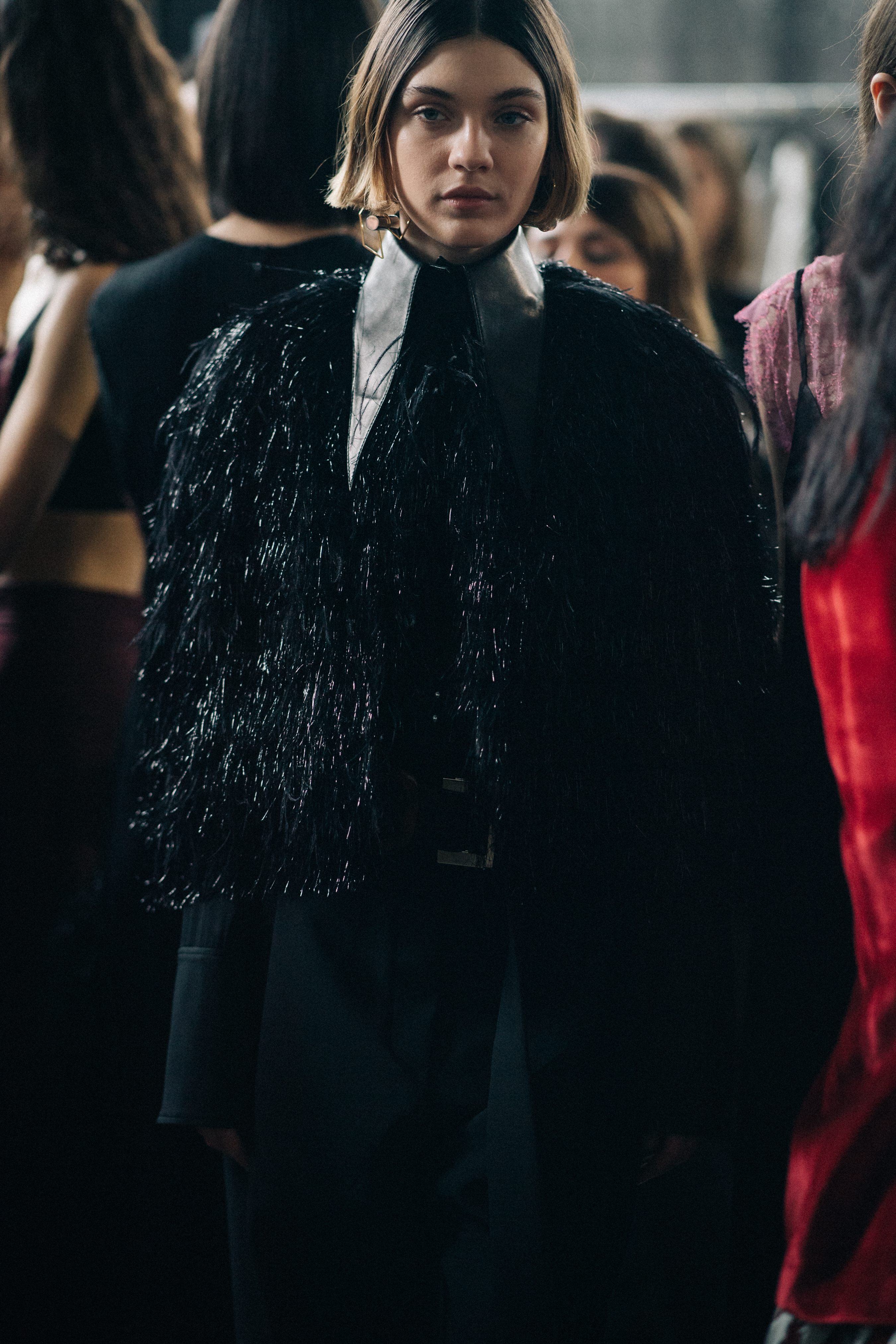 Model Milena Litvinovskaya wearing black coat