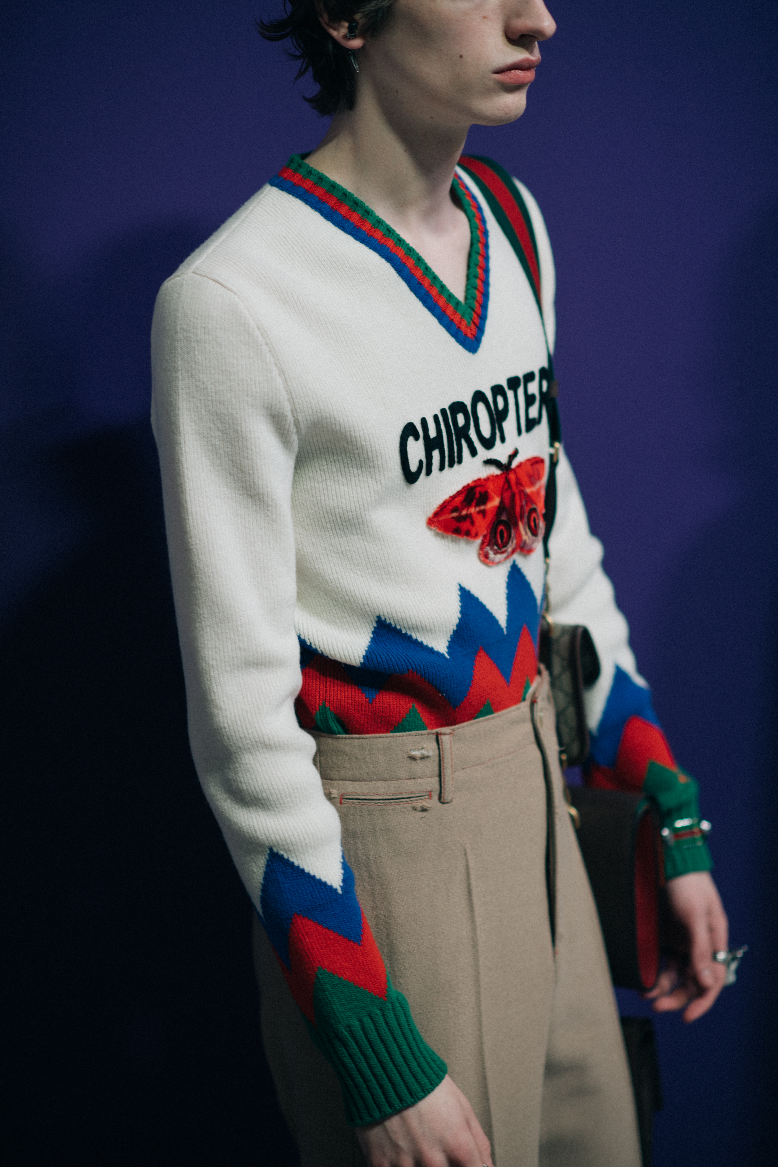 Male model wearing white sweater