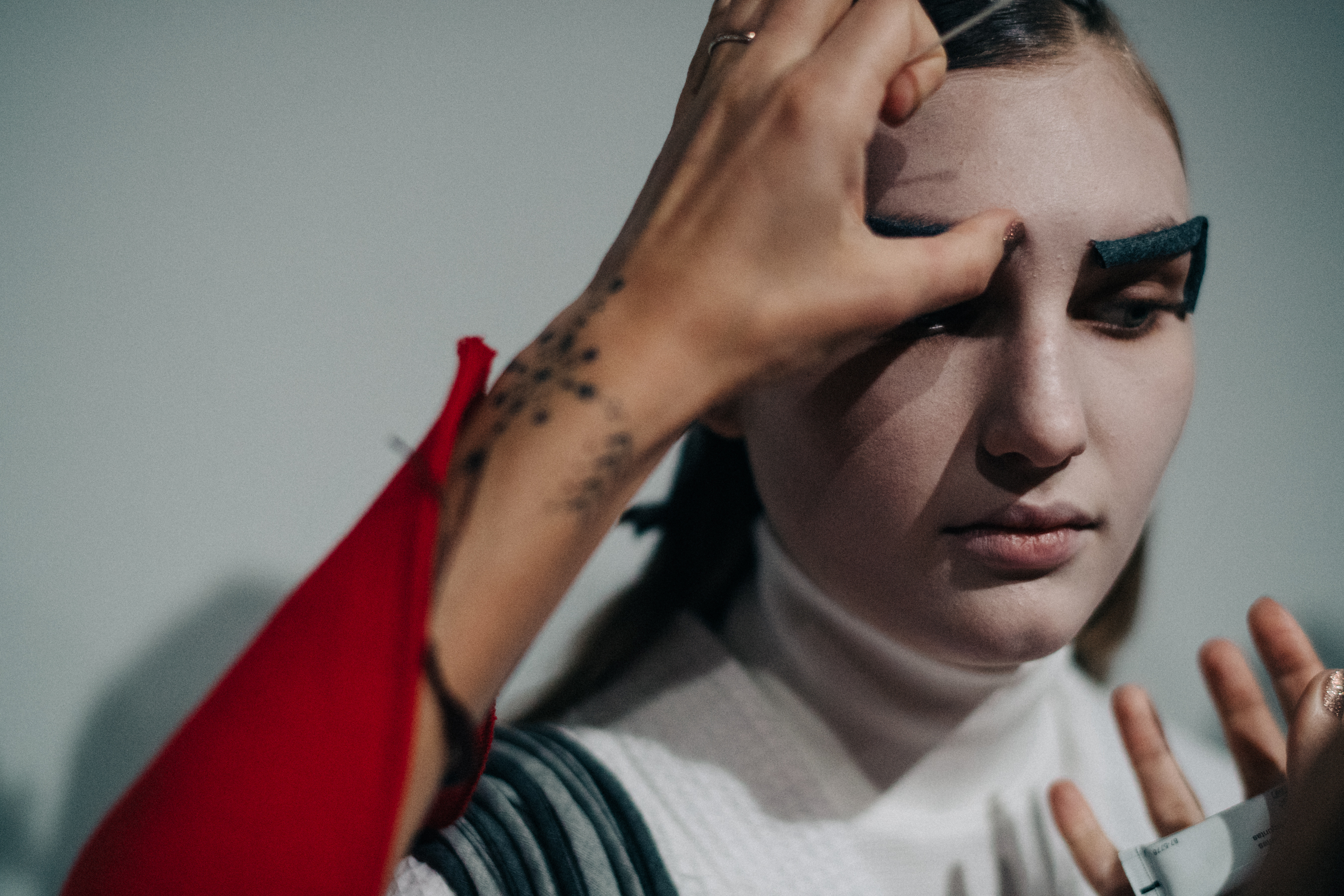 Model preparing makeup before the show