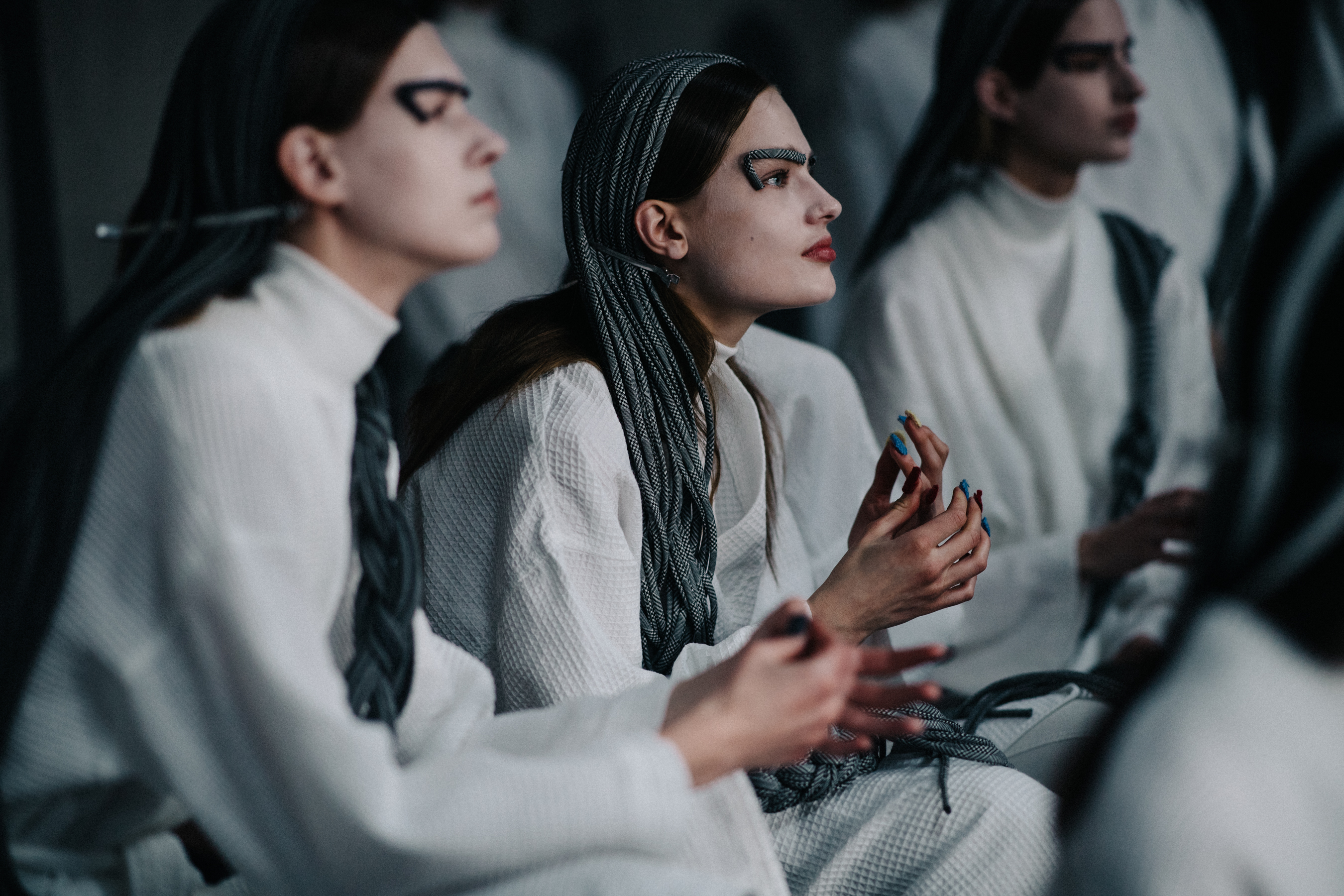 Model wearing white before the show