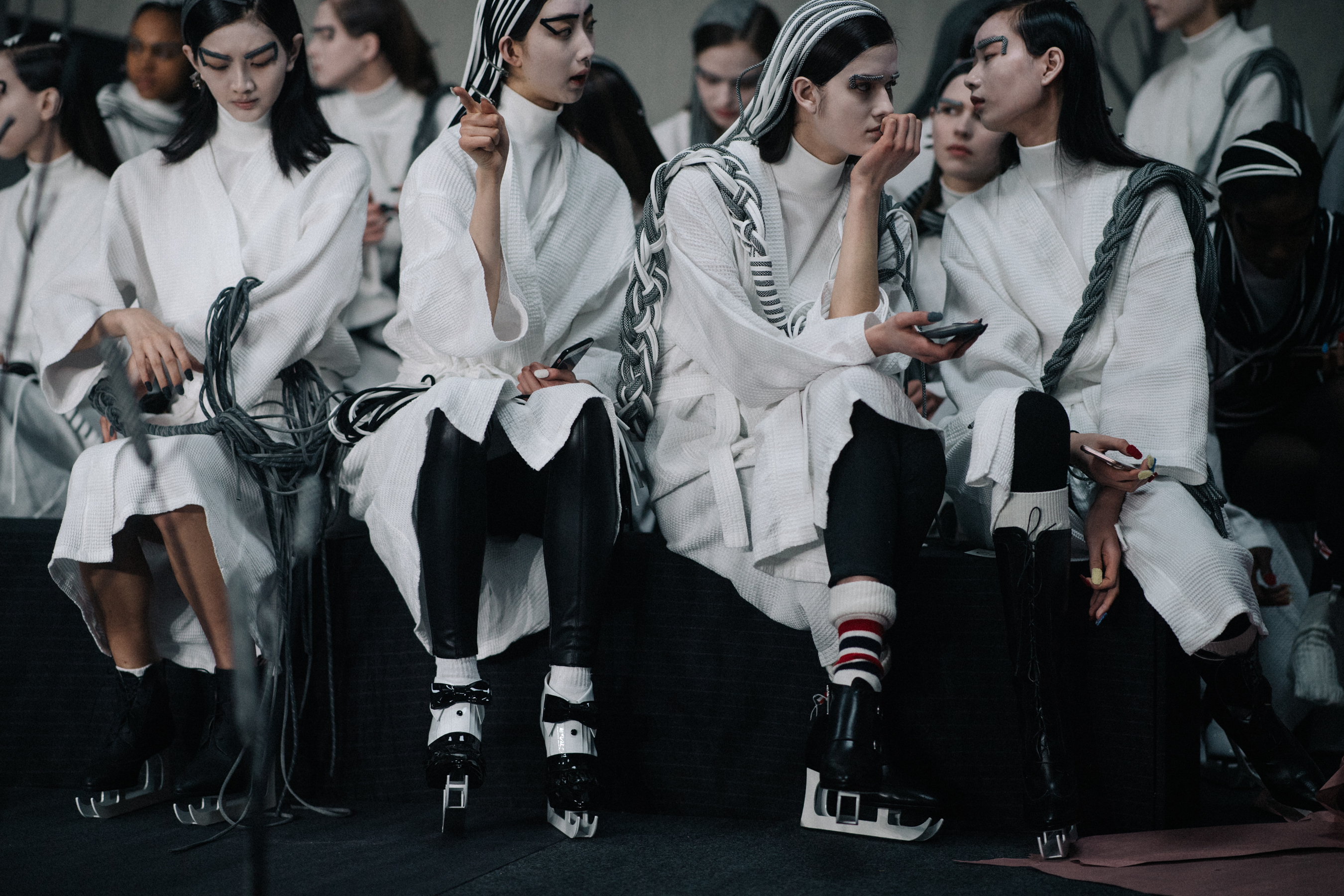 Model wearing white before the show