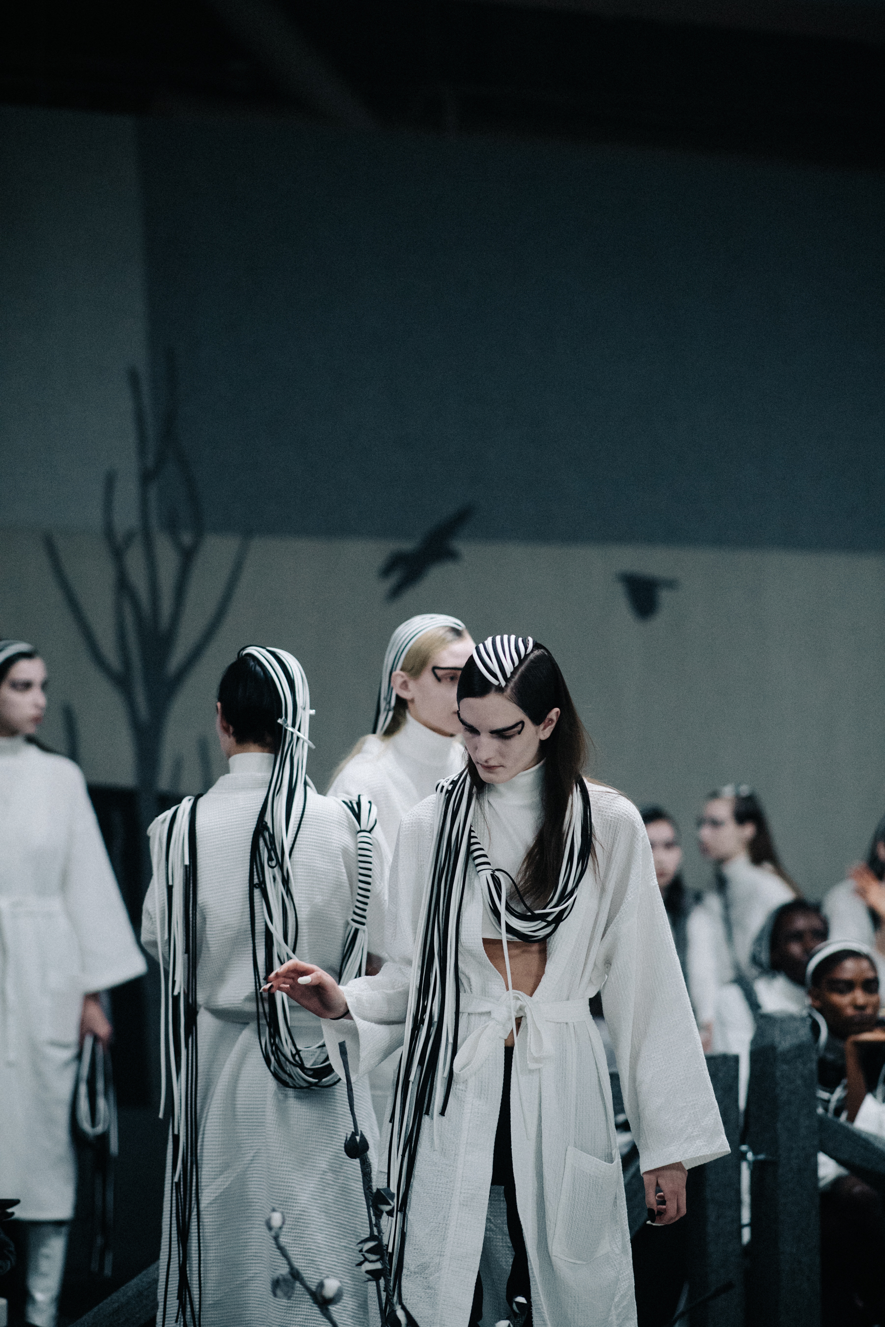 Models wearing white before the show