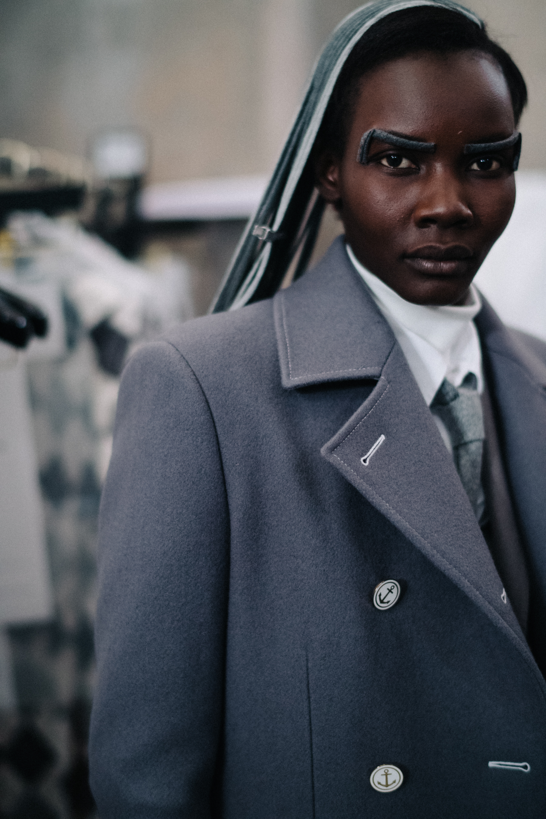 Tricia Akello wearing grey