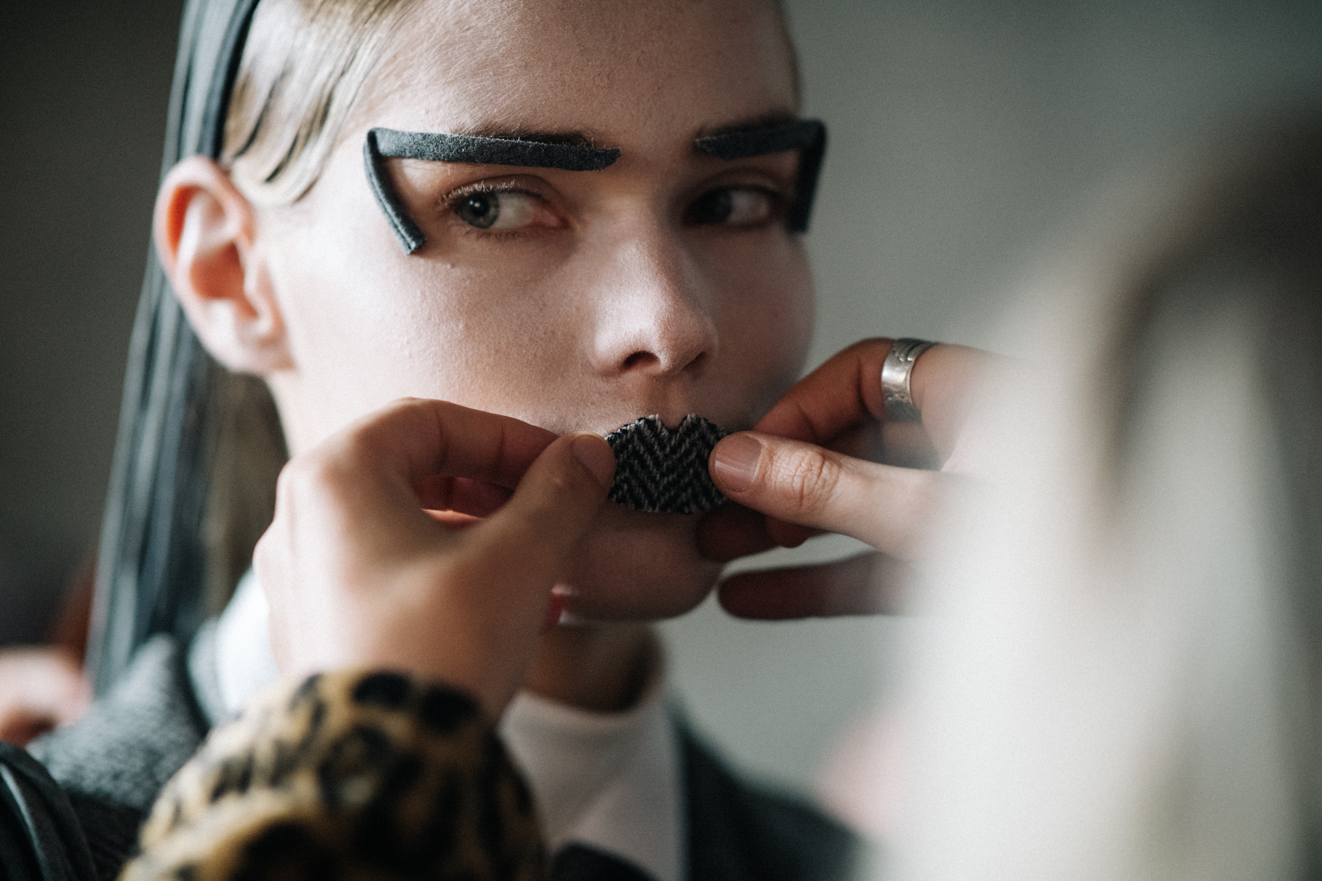 Model preparing makeup for the show