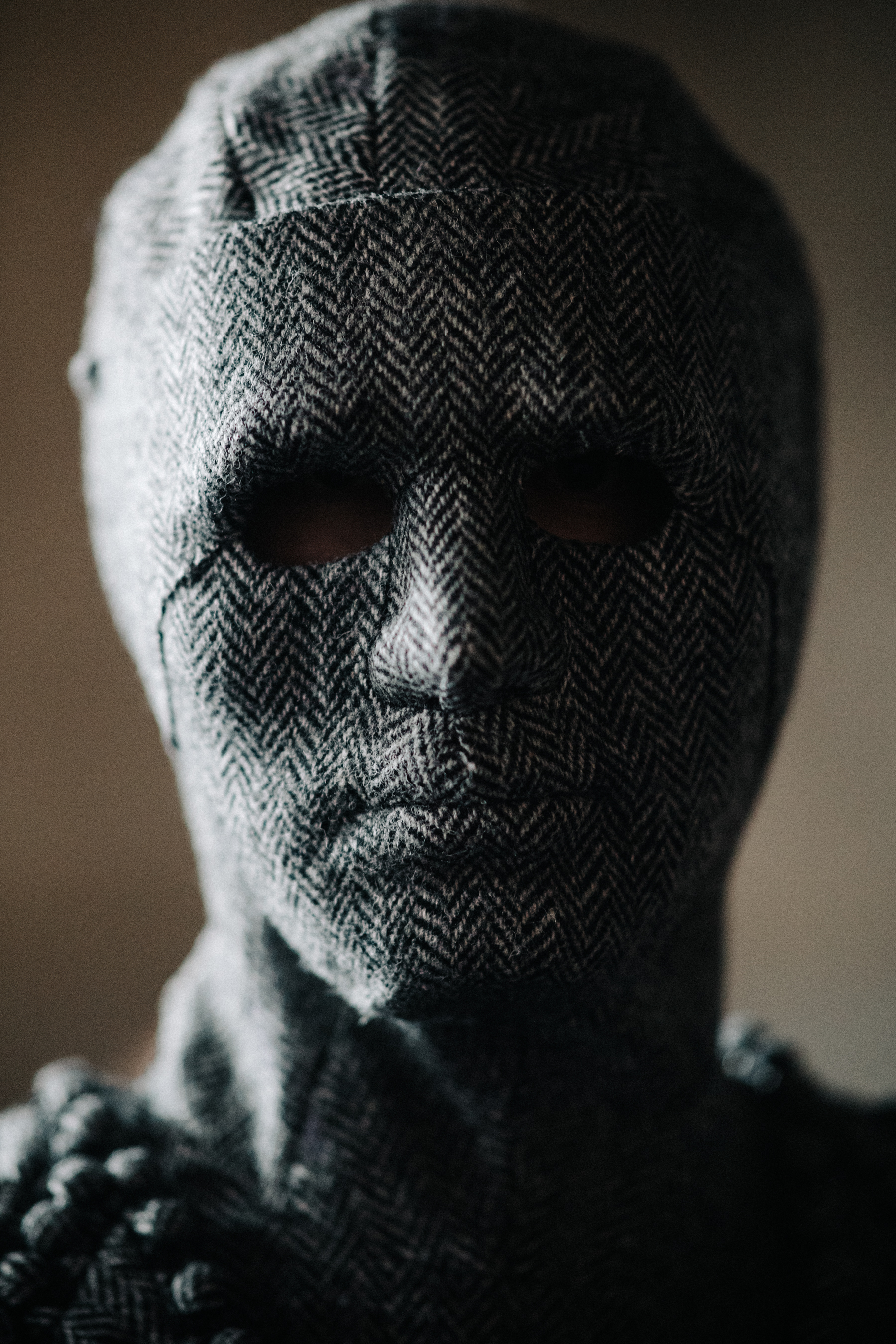 Portrait of model wearing grey mask